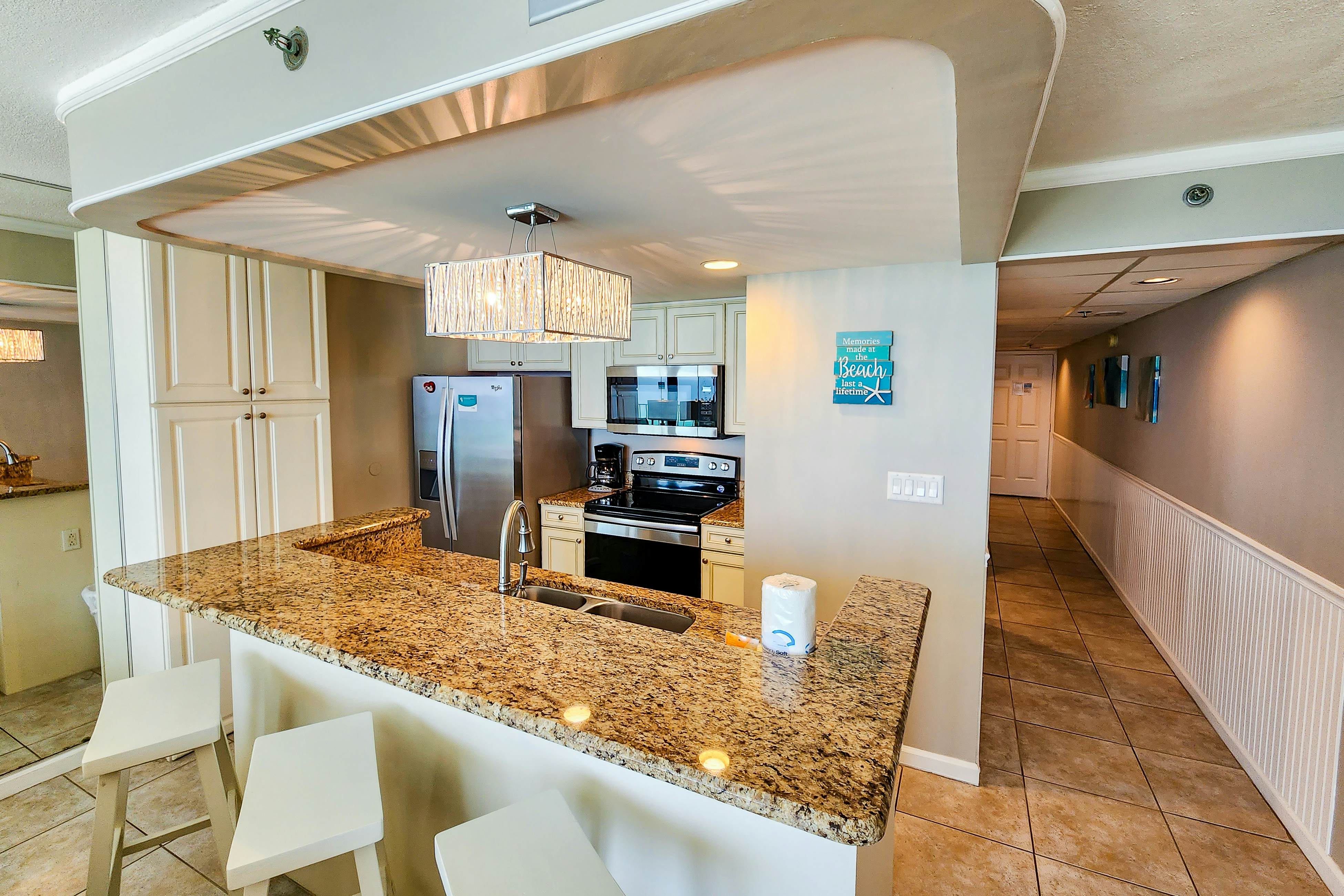 Exquisite beachfront condo with pool, hot tub, balcony, central AC, & W/D