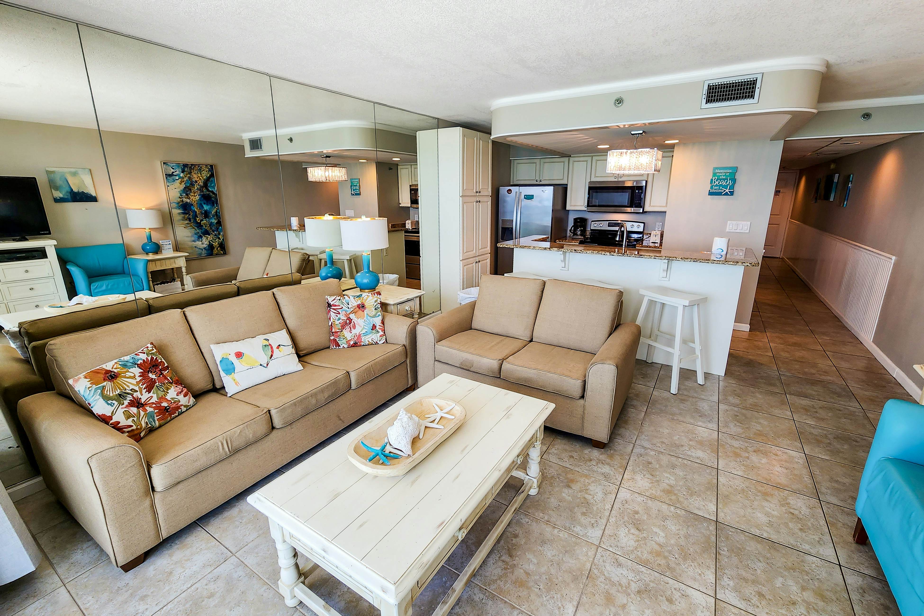 Exquisite beachfront condo with pool, hot tub, balcony, central AC, & W/D