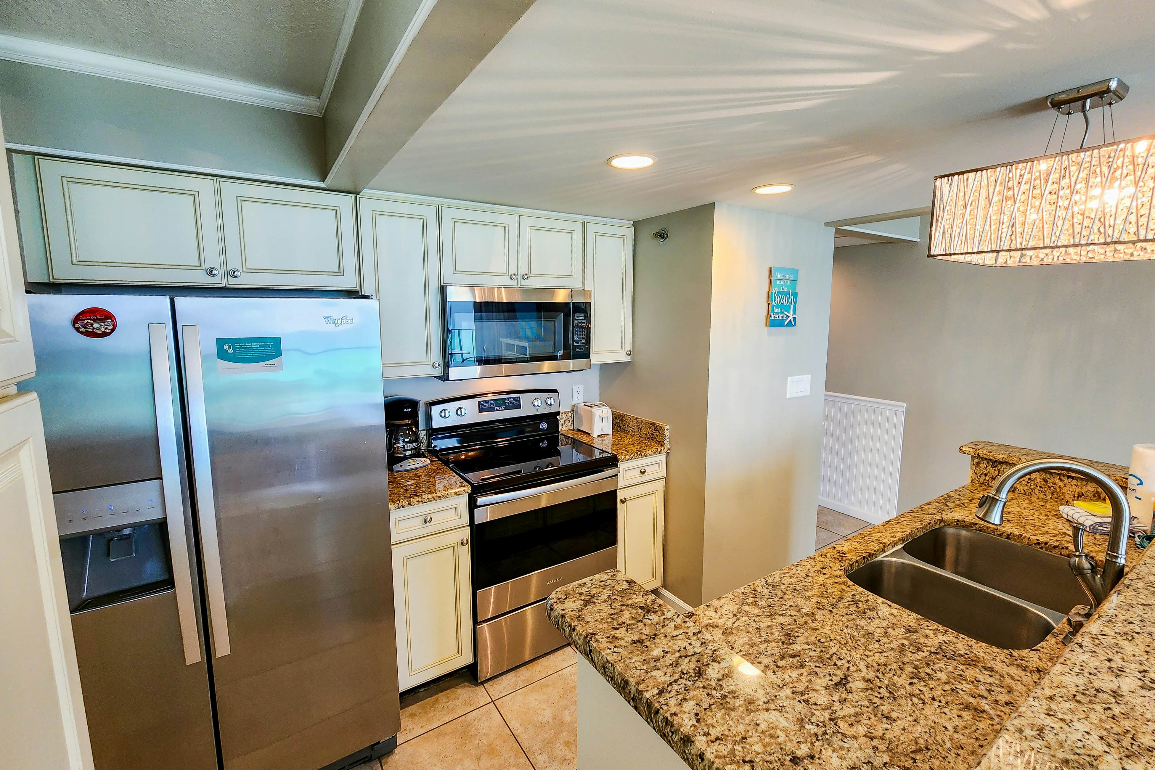 Exquisite beachfront condo with pool, hot tub, balcony, central AC, & W/D