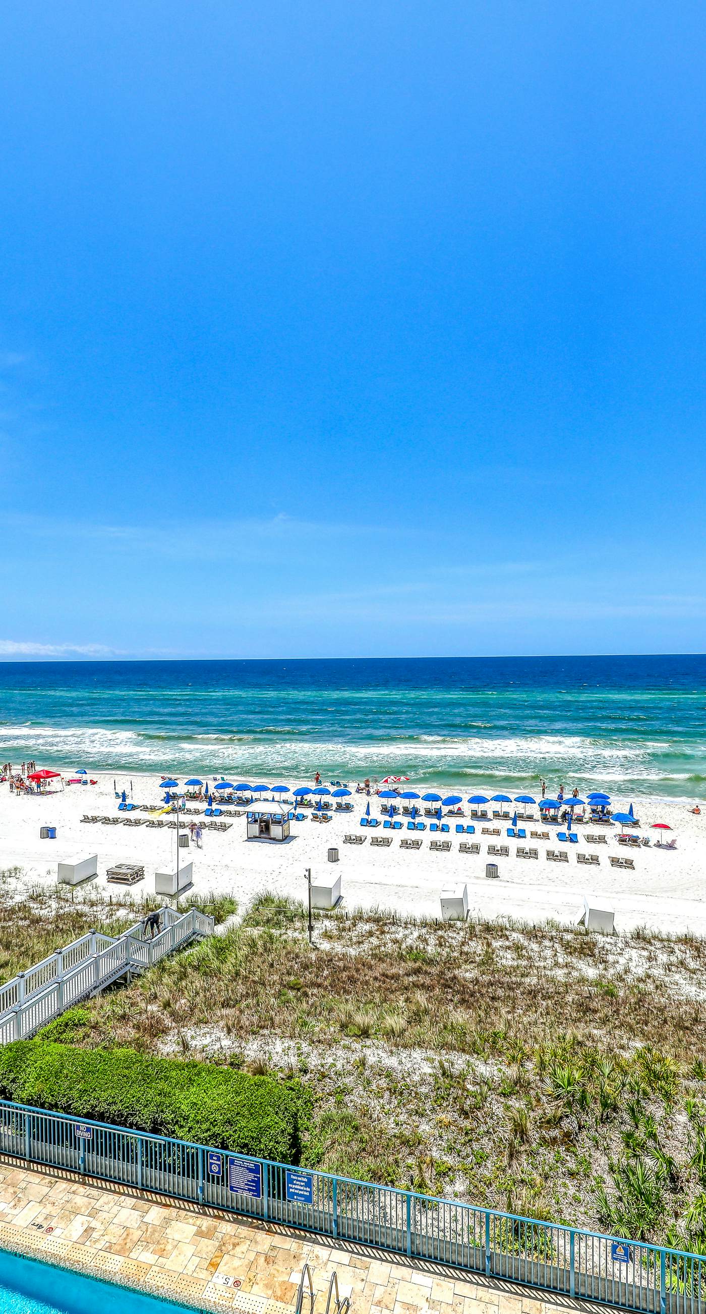 Gulf-front condo with balcony, beach access, hot tub, pool & gym