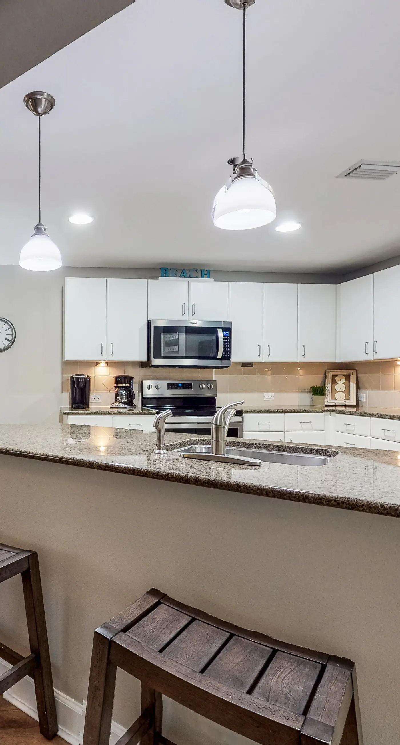 Water-view condo with central AC, pool & private beach access