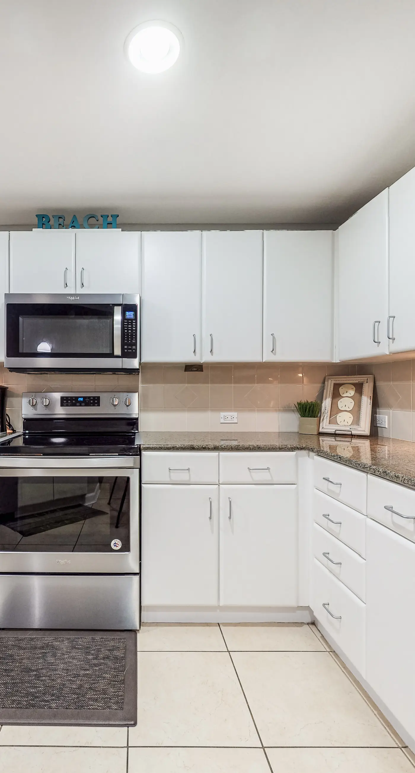 Water-view condo with central AC, pool & private beach access