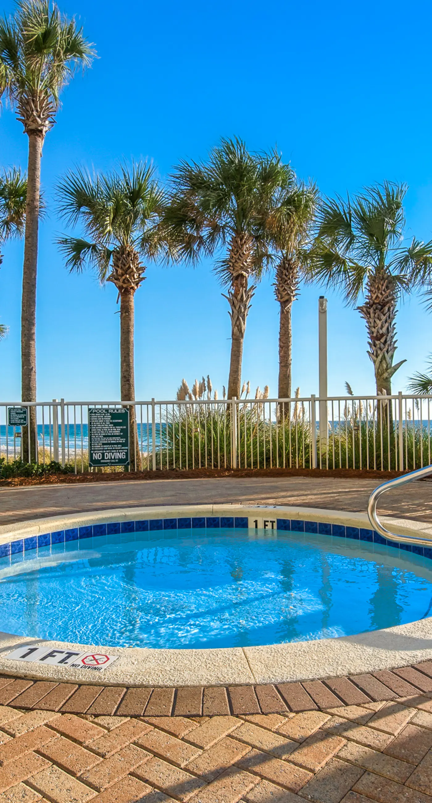 Water-view condo with central AC, pool & private beach access