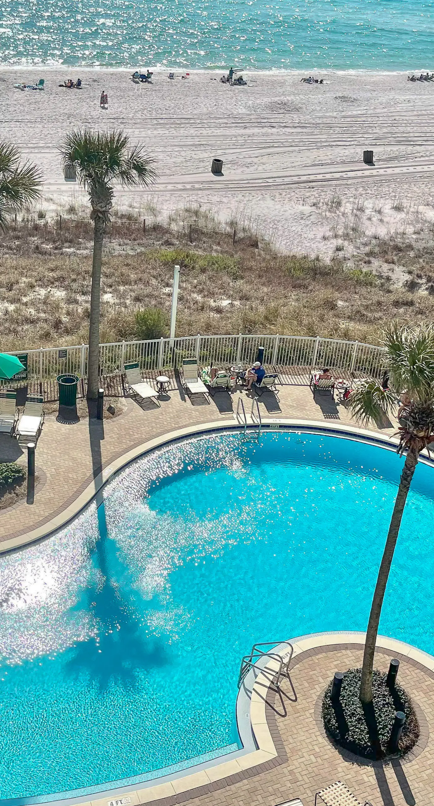 Fifth-floor beachfront condo with furnished balcony, pools, hot tub & grills