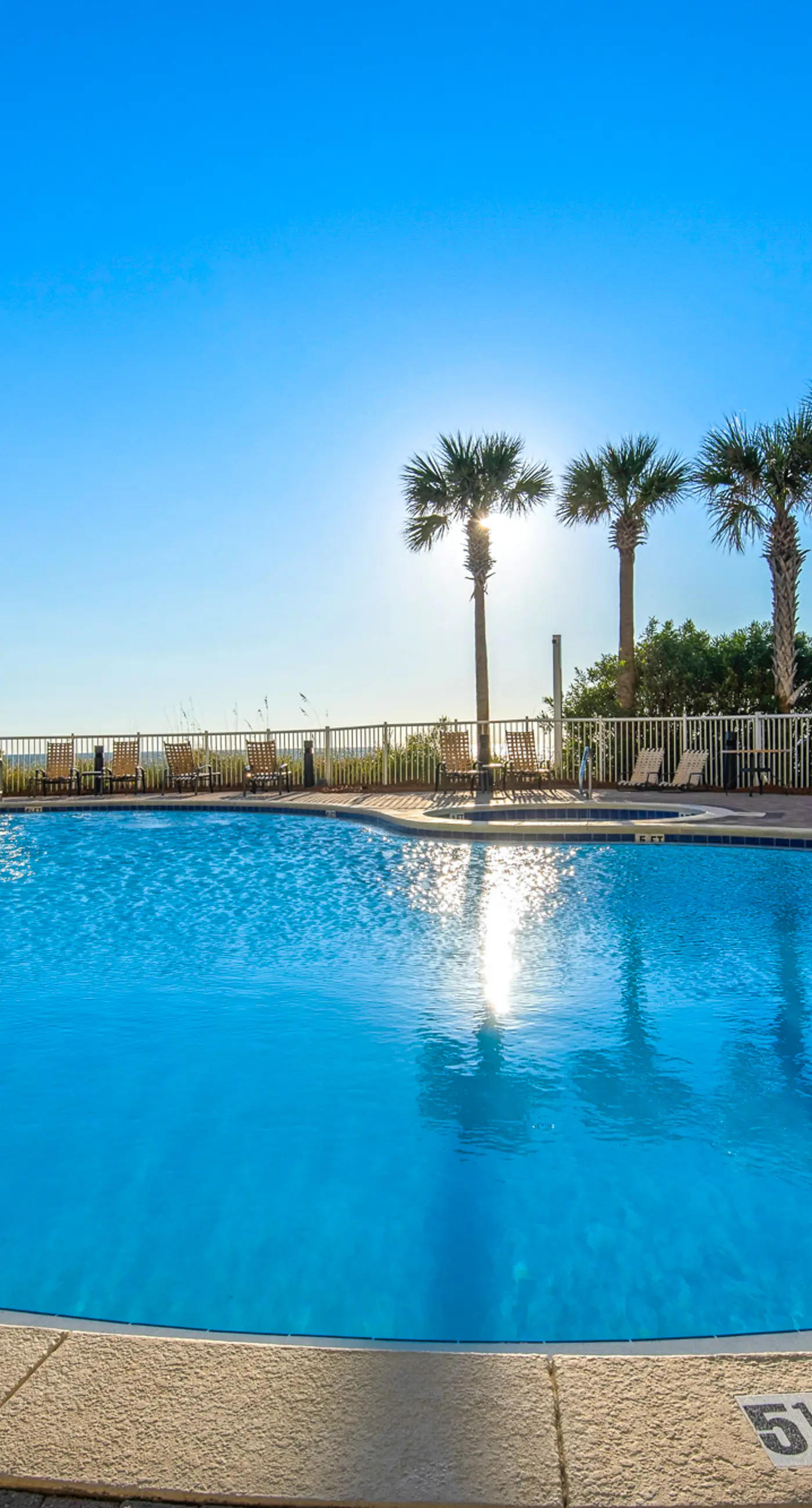 Fifth-floor beachfront condo with furnished balcony, pools, hot tub & grills