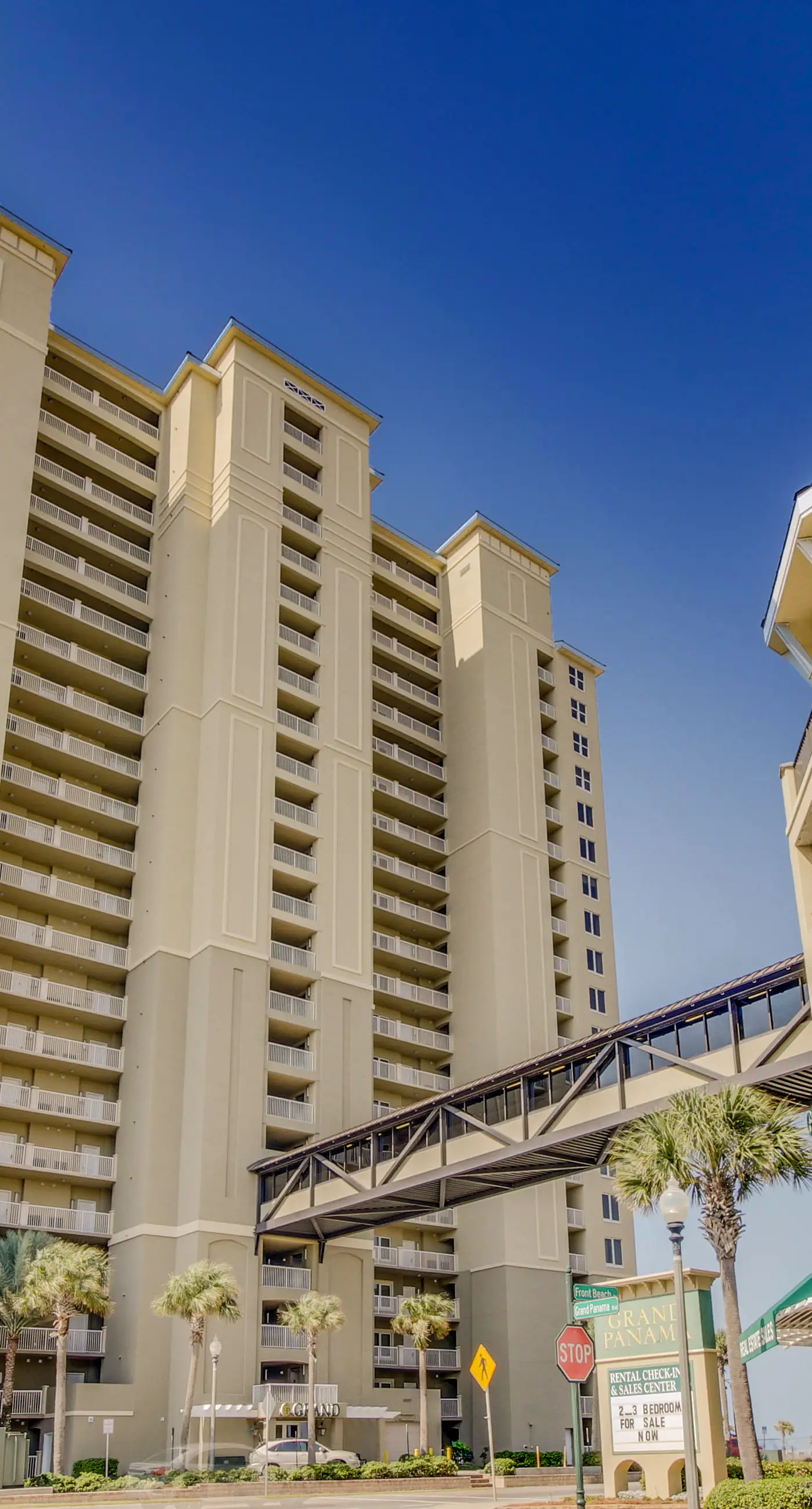 Fifth-floor beachfront condo with furnished balcony, pools, hot tub & grills