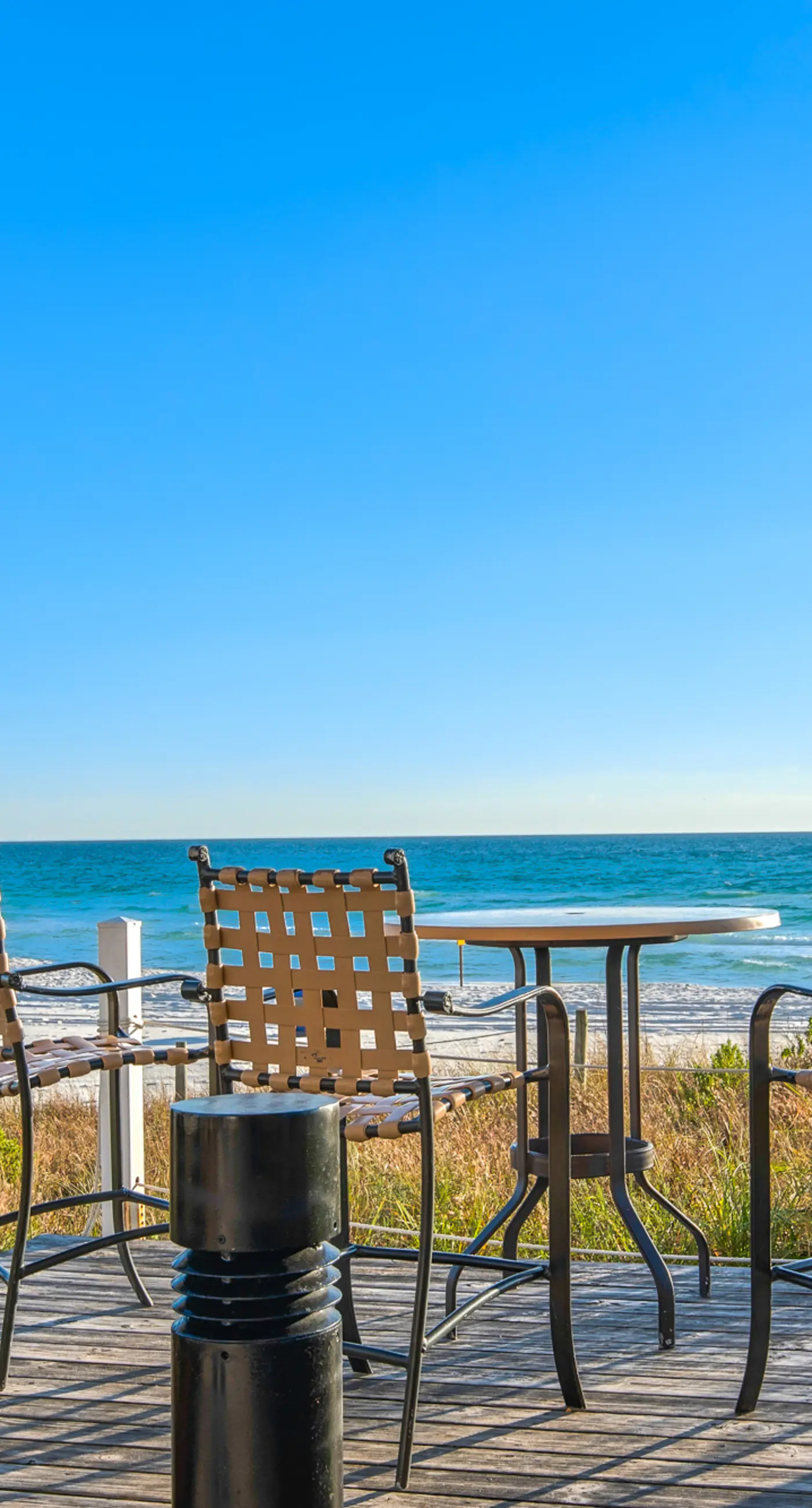 Ideal condo with balcony, gulf views, shared pools, hot tub, gym, fast WiFi & AC