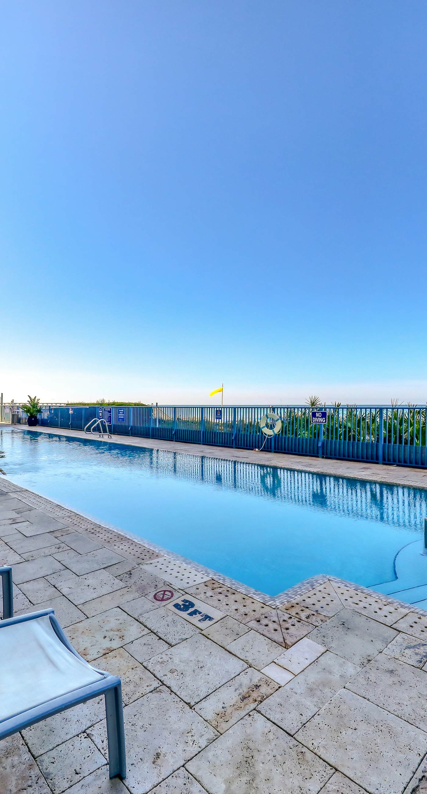 Beachfront condo with Gulf views, grill, balcony, outdoor pool, gym & hot tub