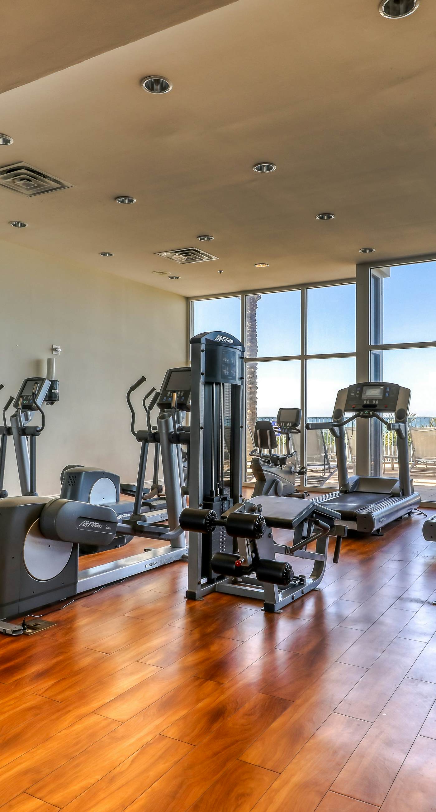 Beachfront condo with Gulf views, grill, balcony, outdoor pool, gym & hot tub