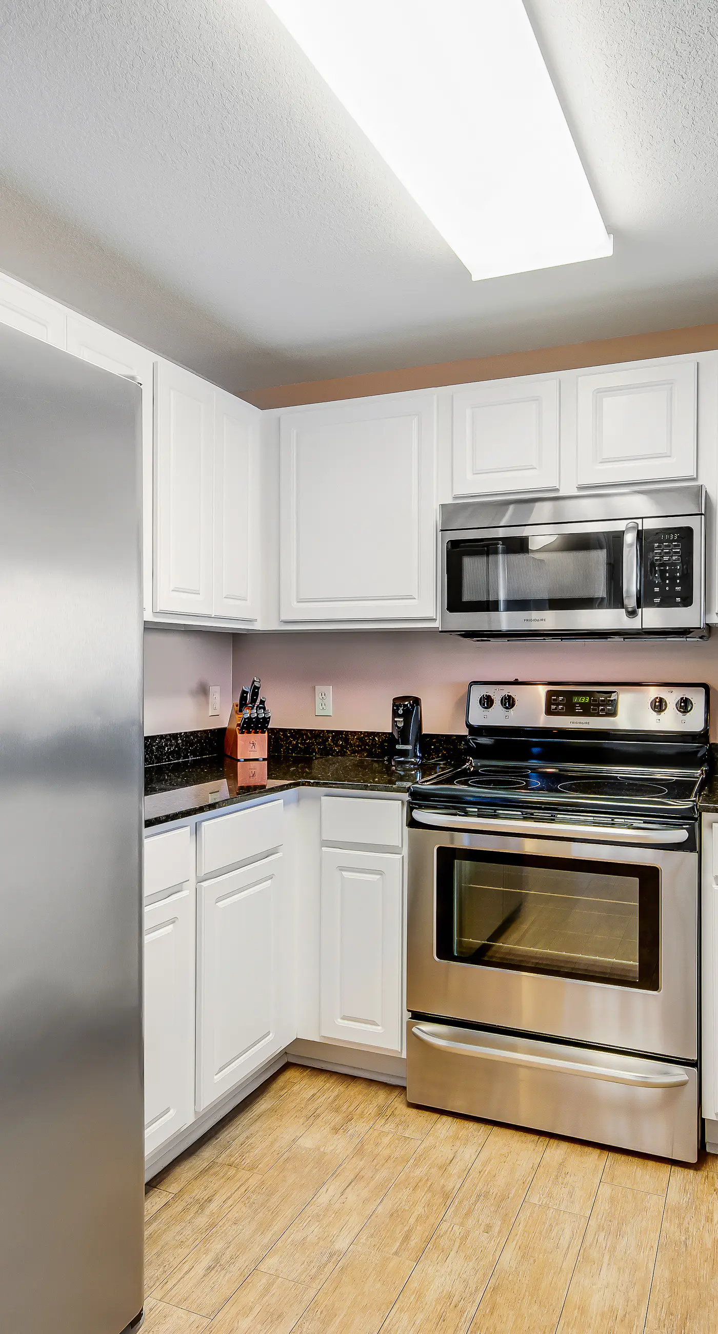 Renovated beachfront condo with balcony & pool