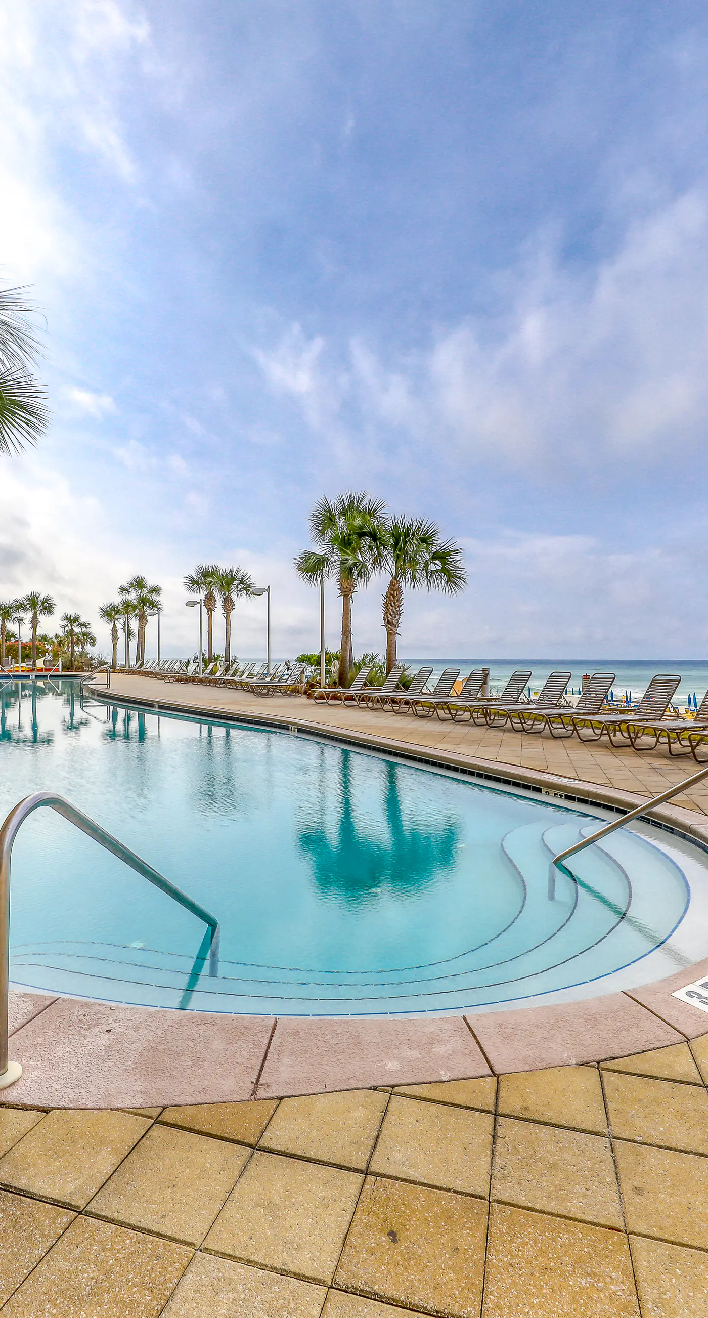 Beach-view, high-rise condo with pool - central location