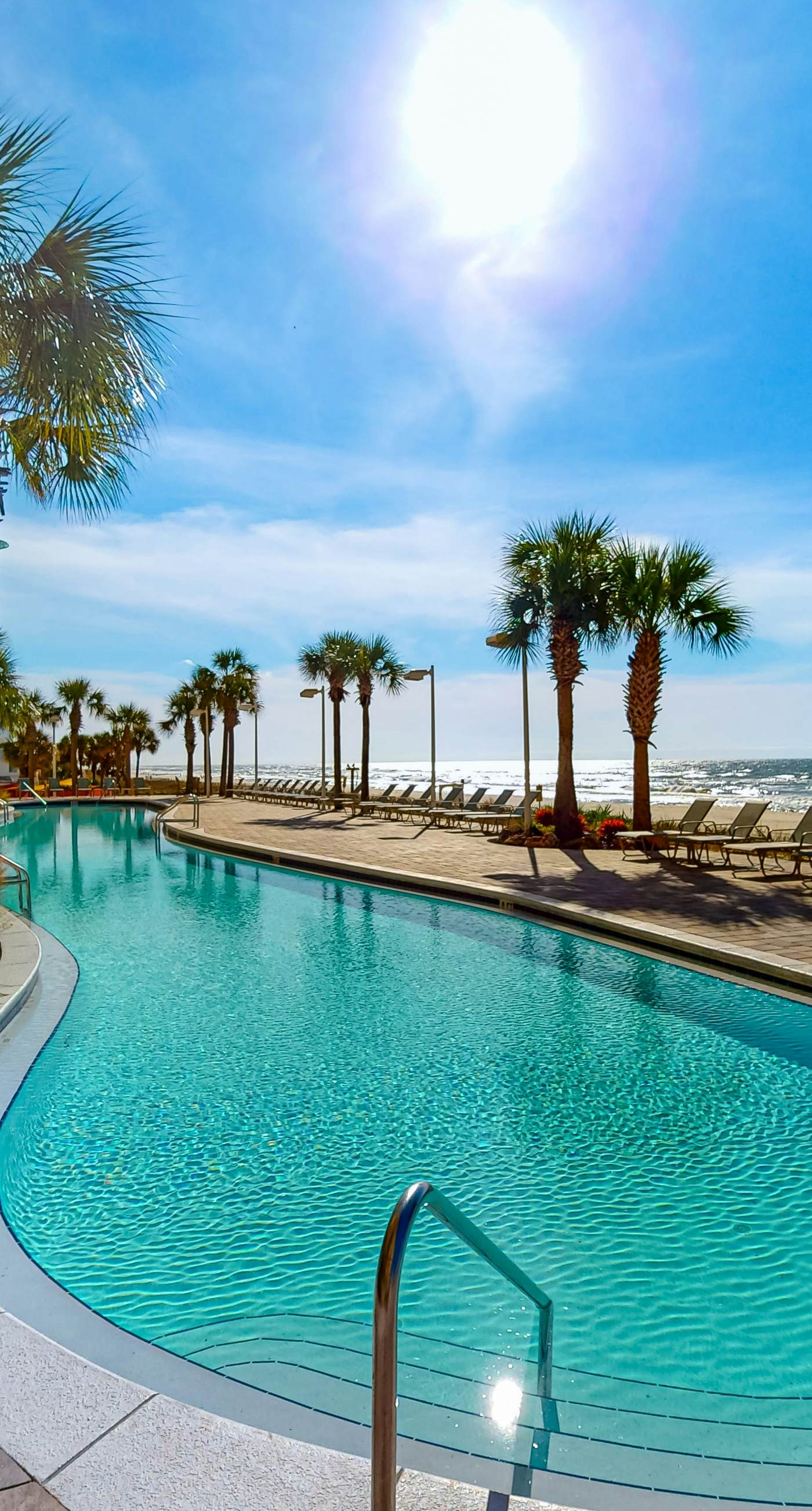 Tropical touches abound with balcony, pools, gym & beach access