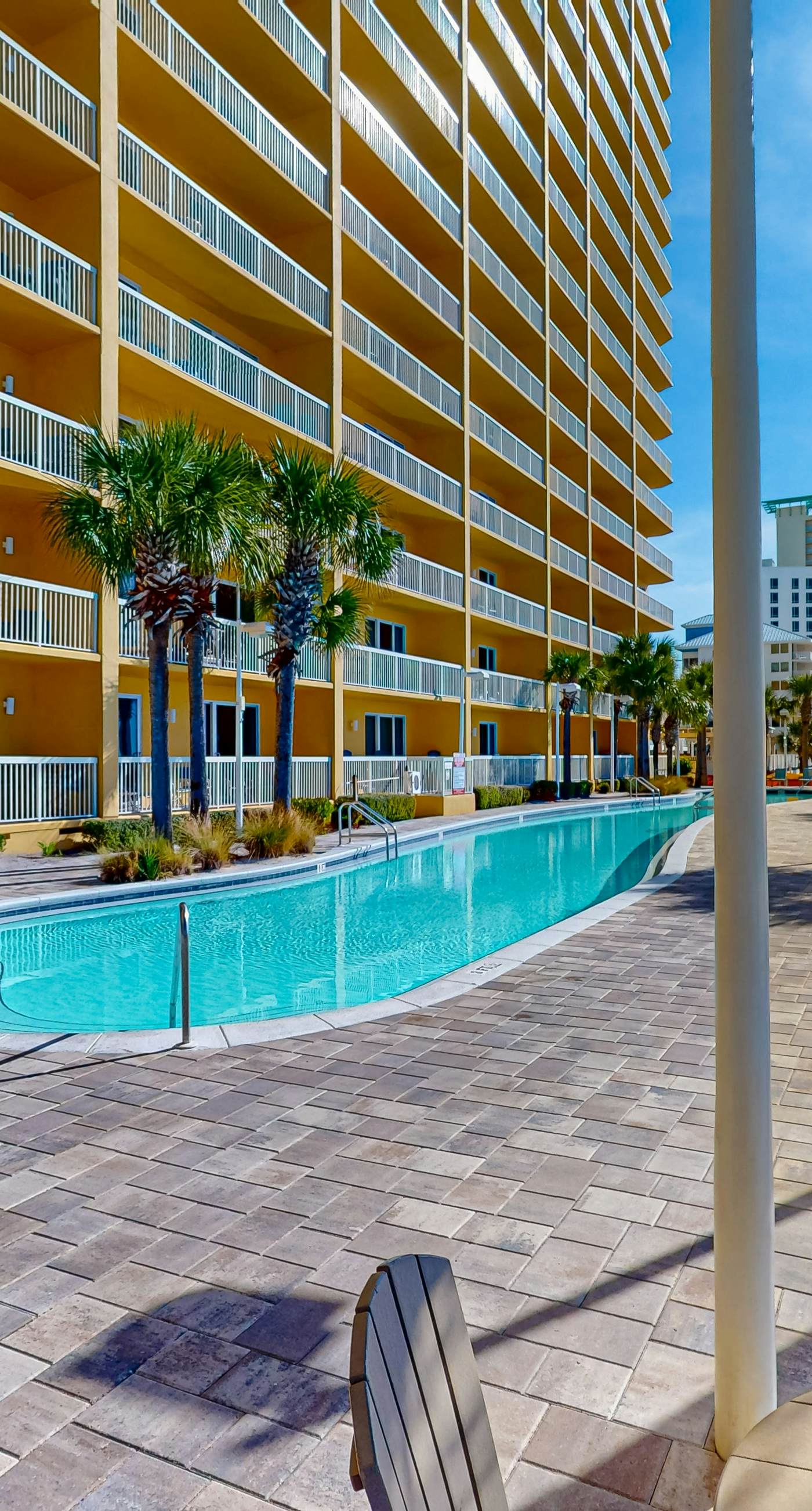 Tropical touches abound with balcony, pools, gym & beach access