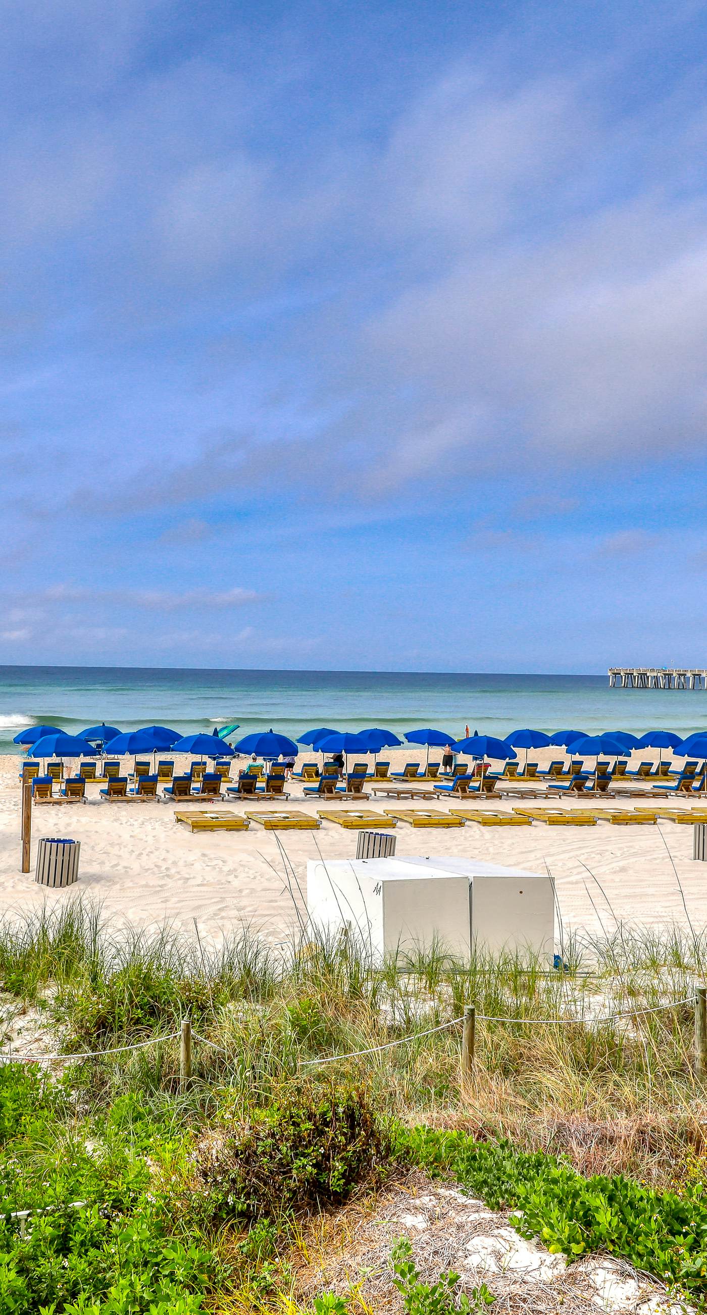Tropical touches abound with balcony, pools, gym & beach access
