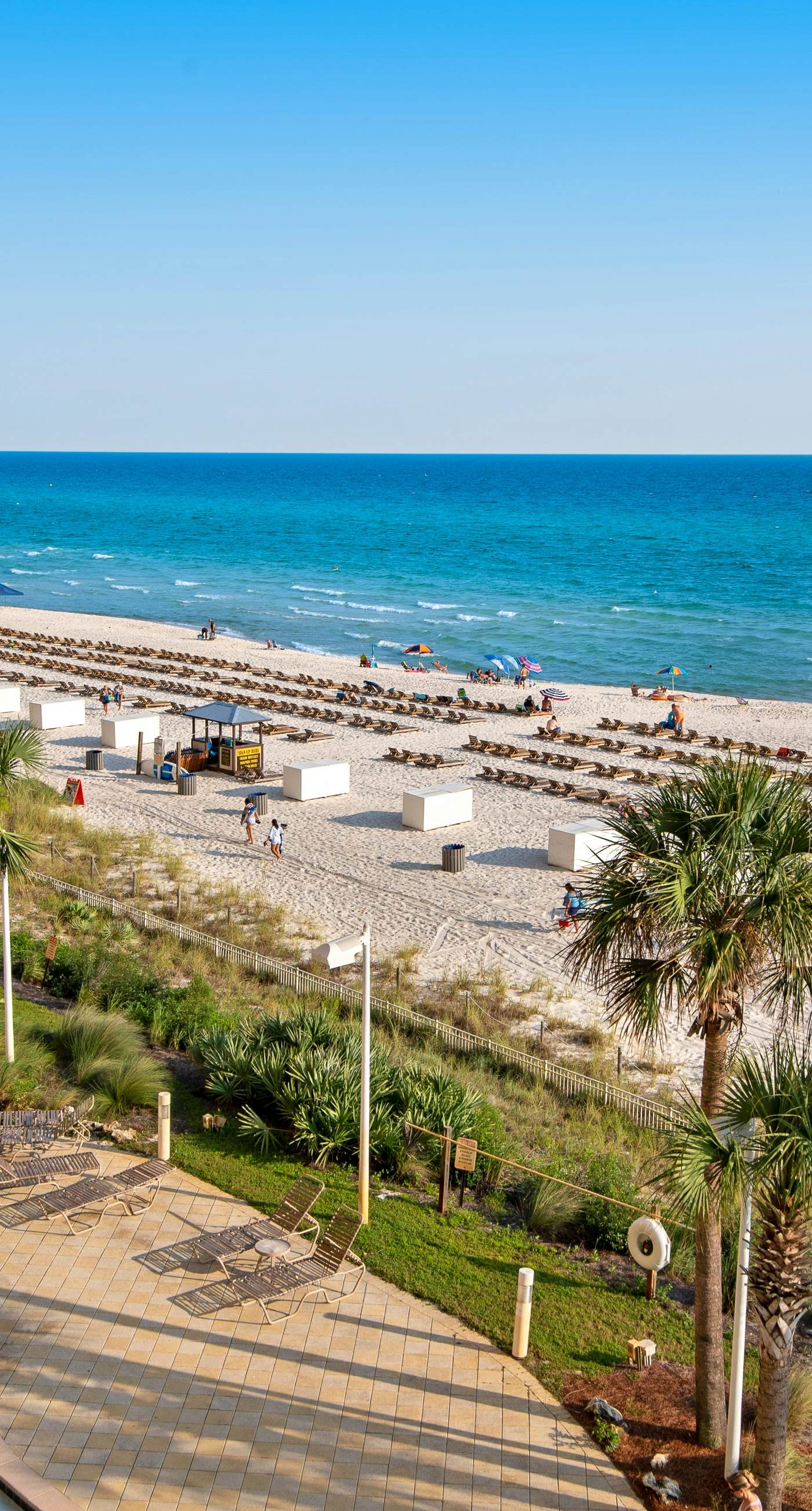 Tropical touches abound with balcony, pools, gym & beach access