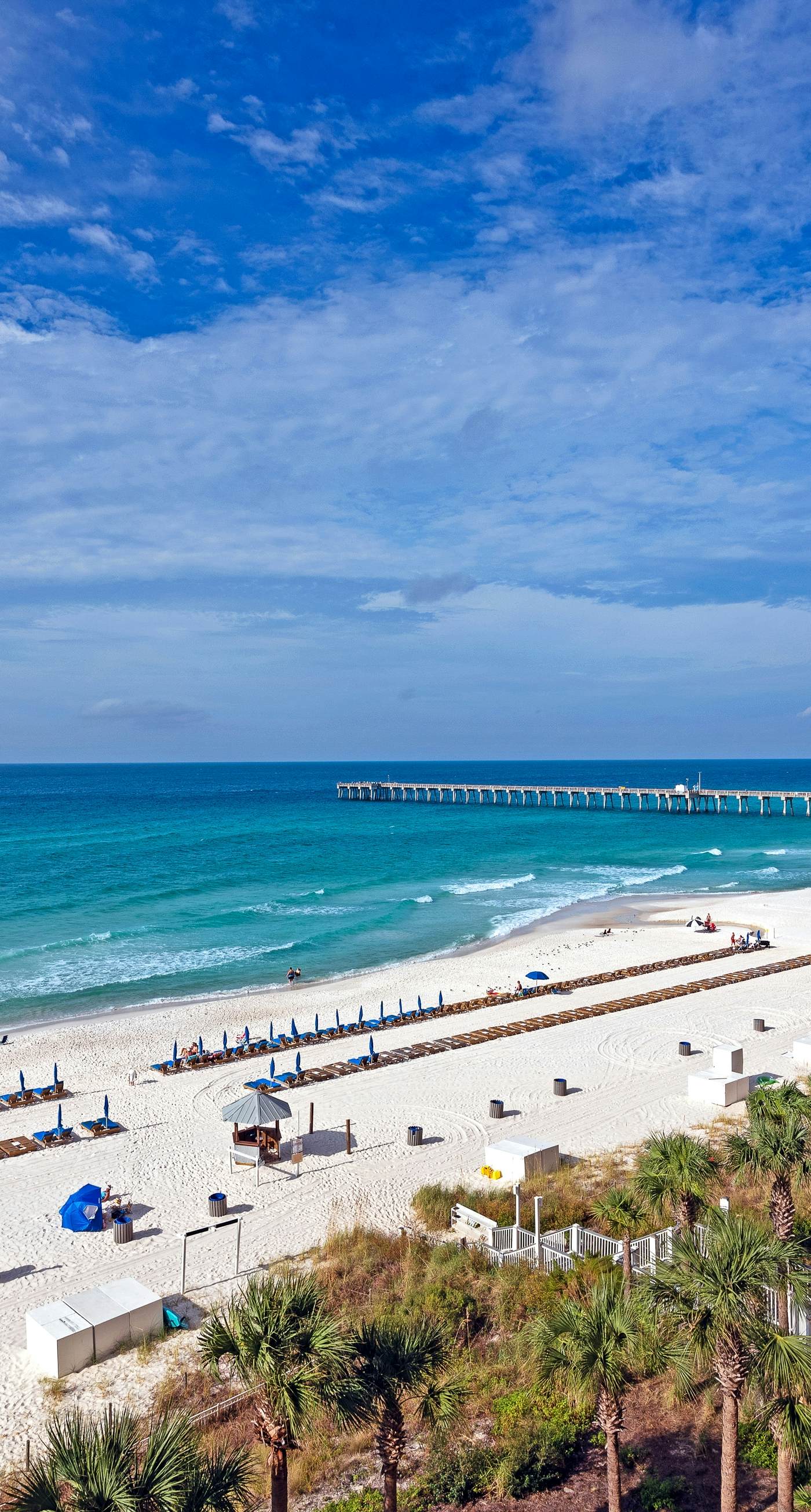 Tropical touches abound with balcony, pools, gym & beach access