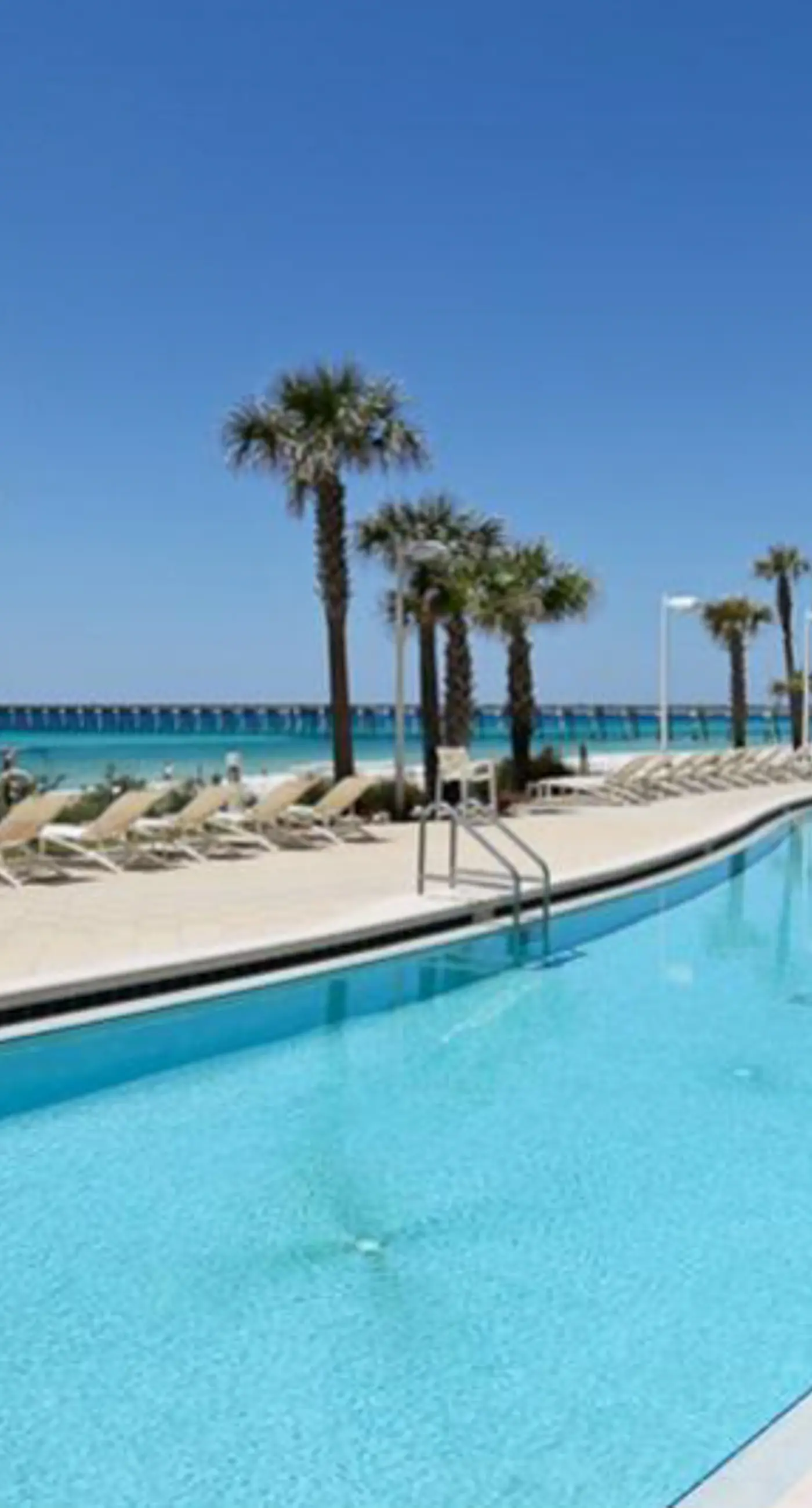 Waterfront condo with balcony, pools, gym & central AC