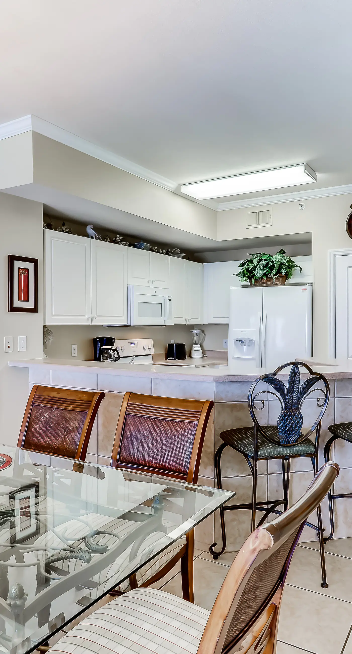 Eclectic gulf front condo with free WiFI, two pools, hot tub, & easy beach access