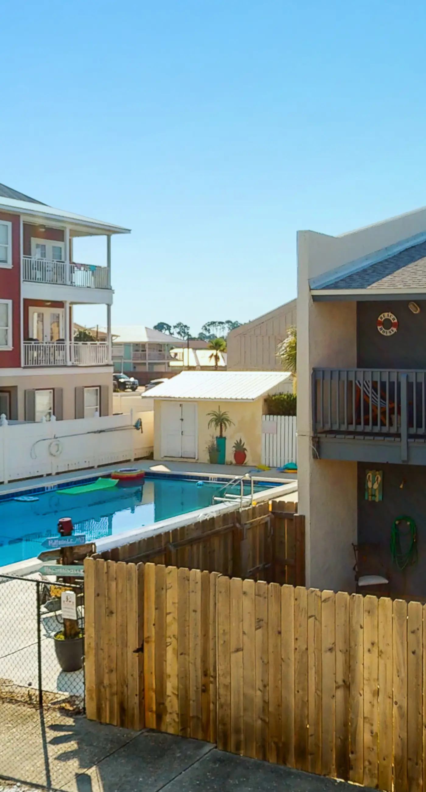 Dog-friendly condo with pool, balcony, beach access, central AC, & W&D