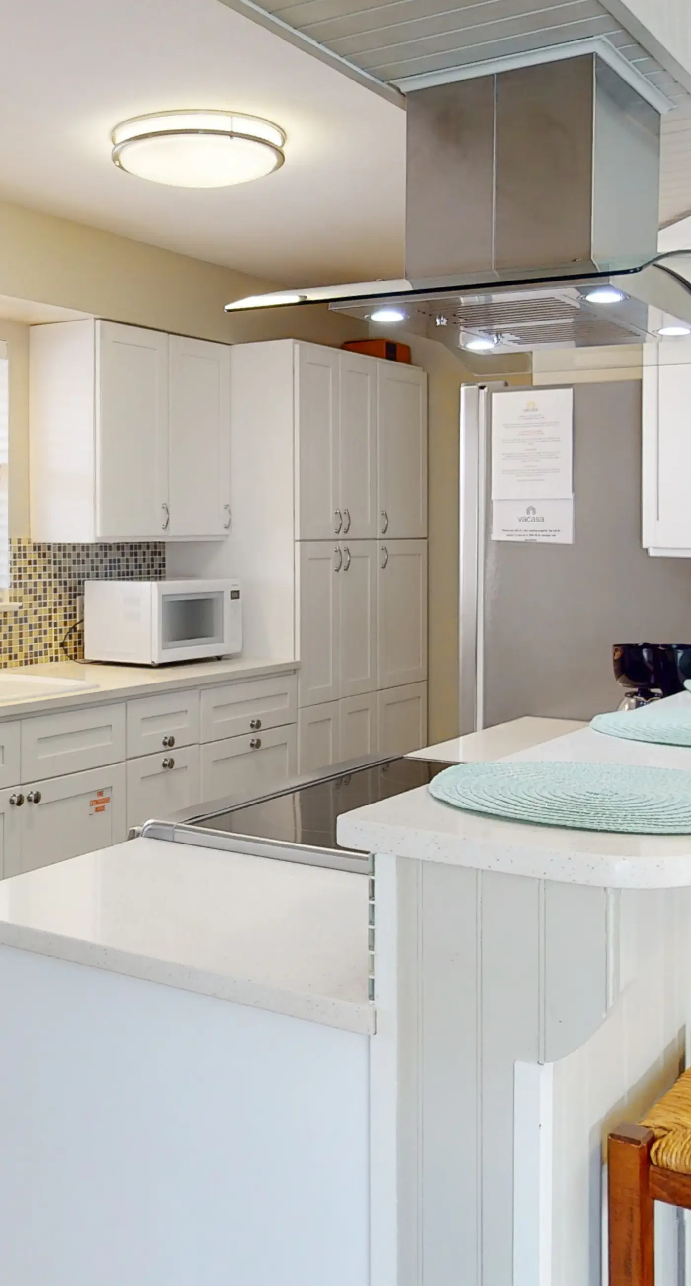 Dog-friendly condo with pool, balcony, beach access, central AC, & W&D