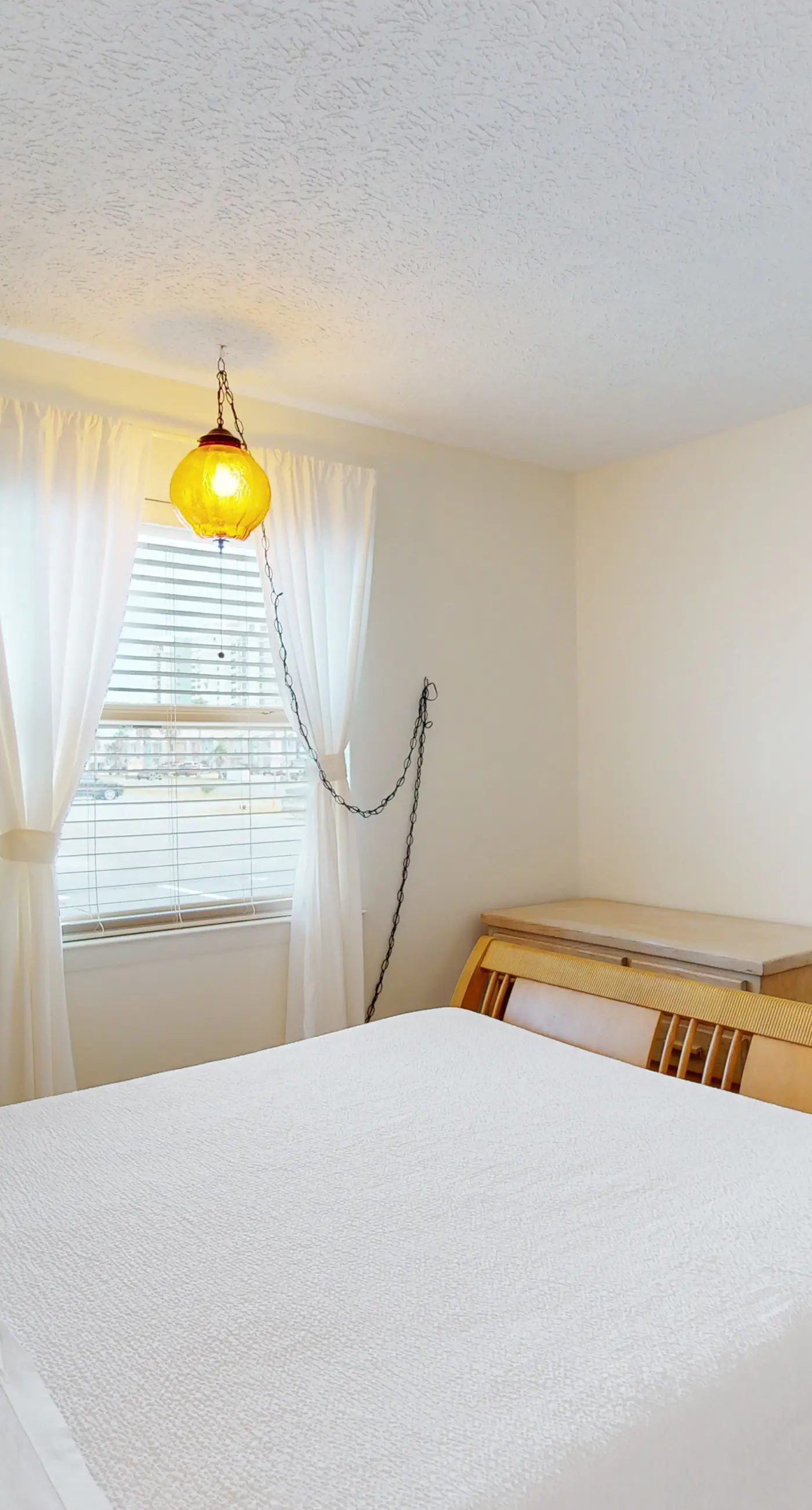 Dog-friendly condo with pool, balcony, beach access, central AC, & W&D