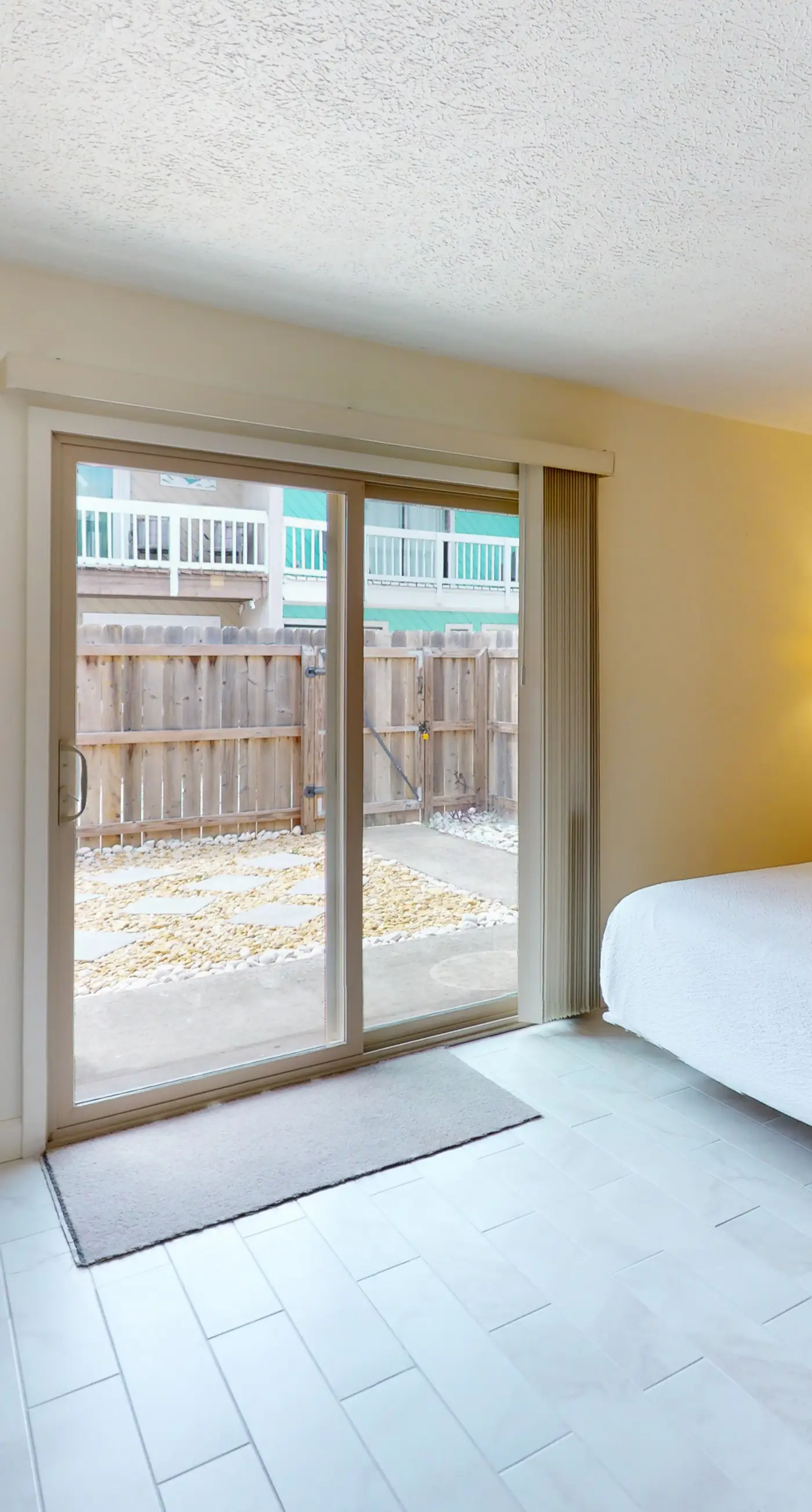 Dog-friendly condo with pool, balcony, beach access, central AC, & W&D