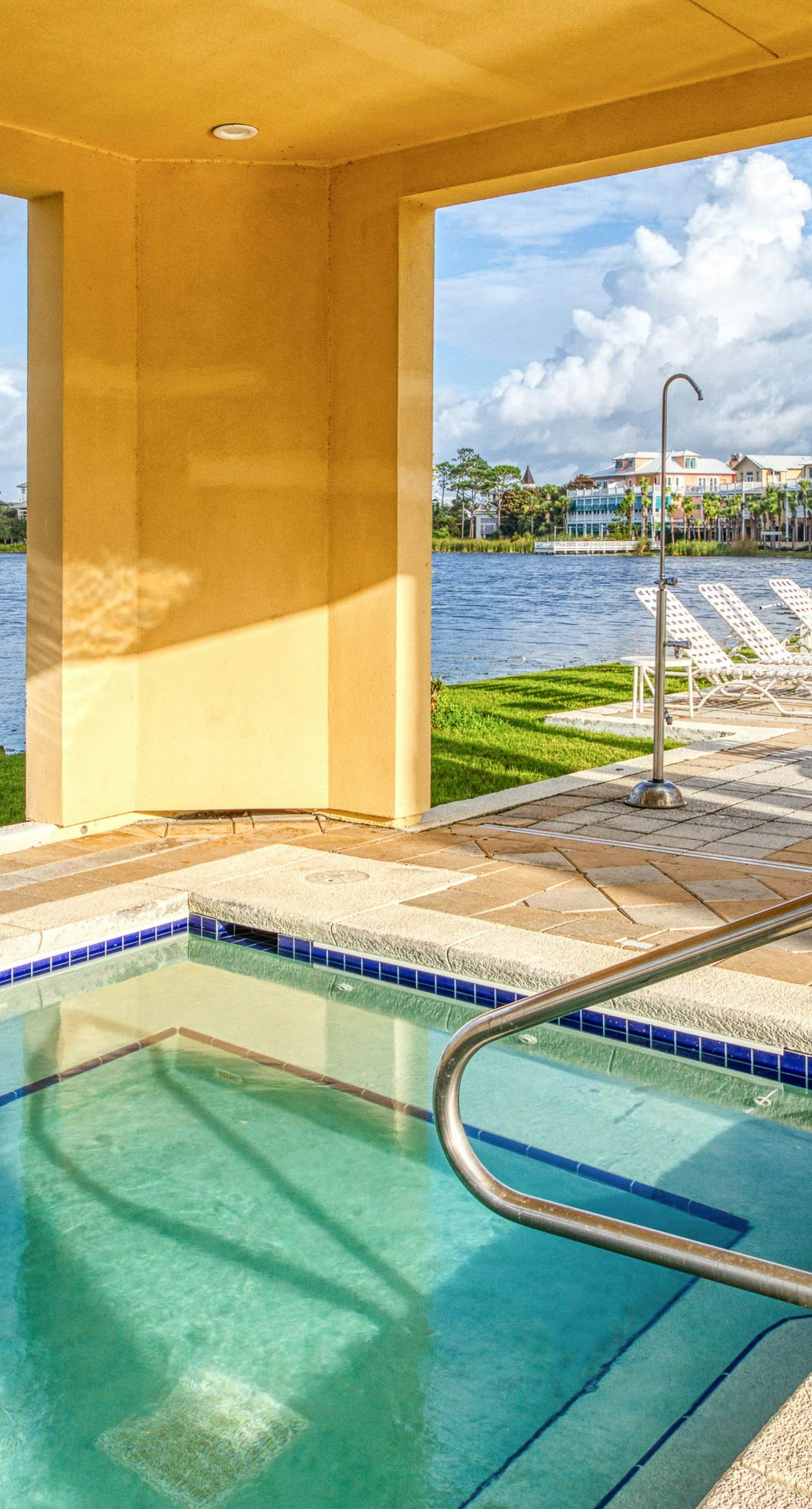 Sunset-view dog-friendly condo w/ balcony overlooking water, beach access, pool & hot tub