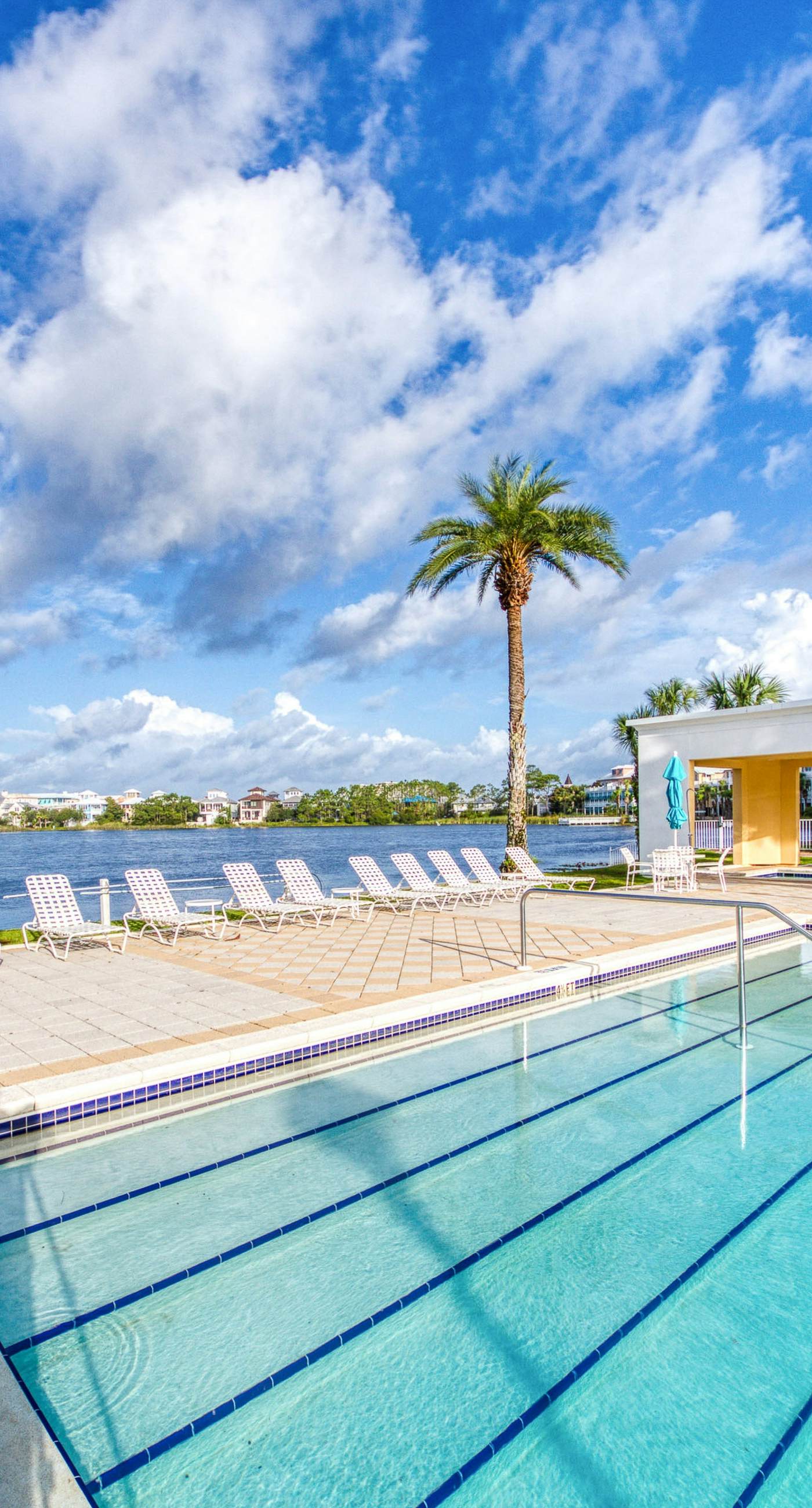 Sunset-view dog-friendly condo w/ balcony overlooking water, beach access, pool & hot tub