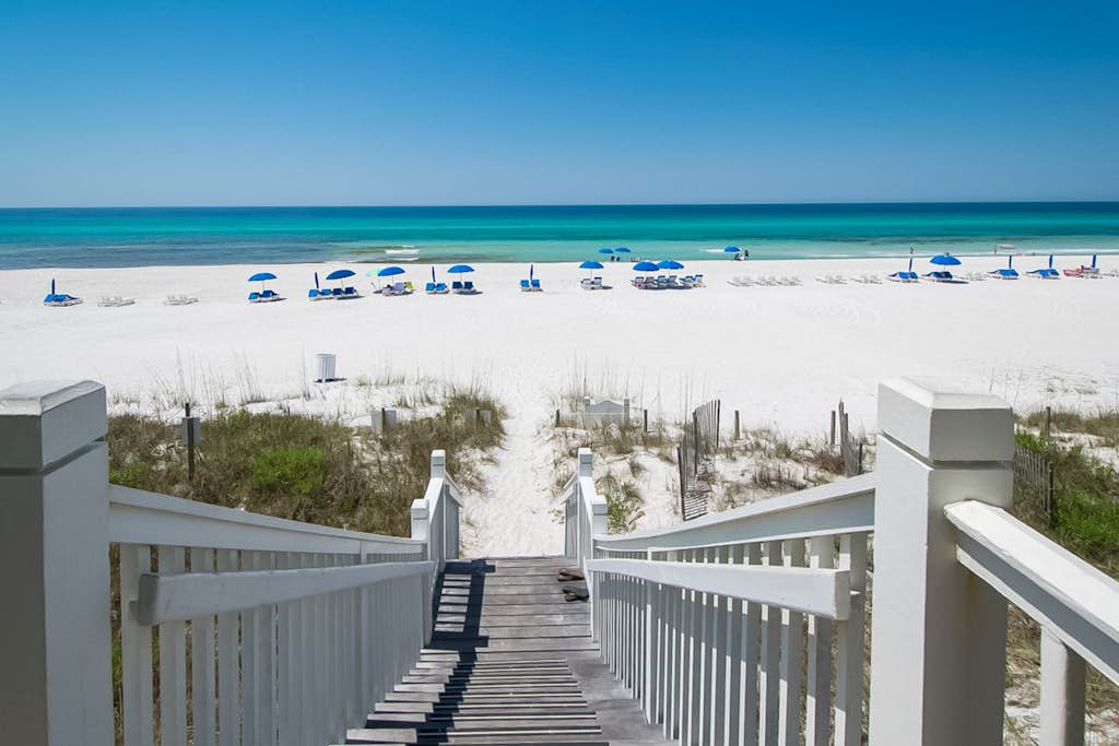 Sunset-view dog-friendly condo w/ balcony overlooking water, beach access, pool & hot tub