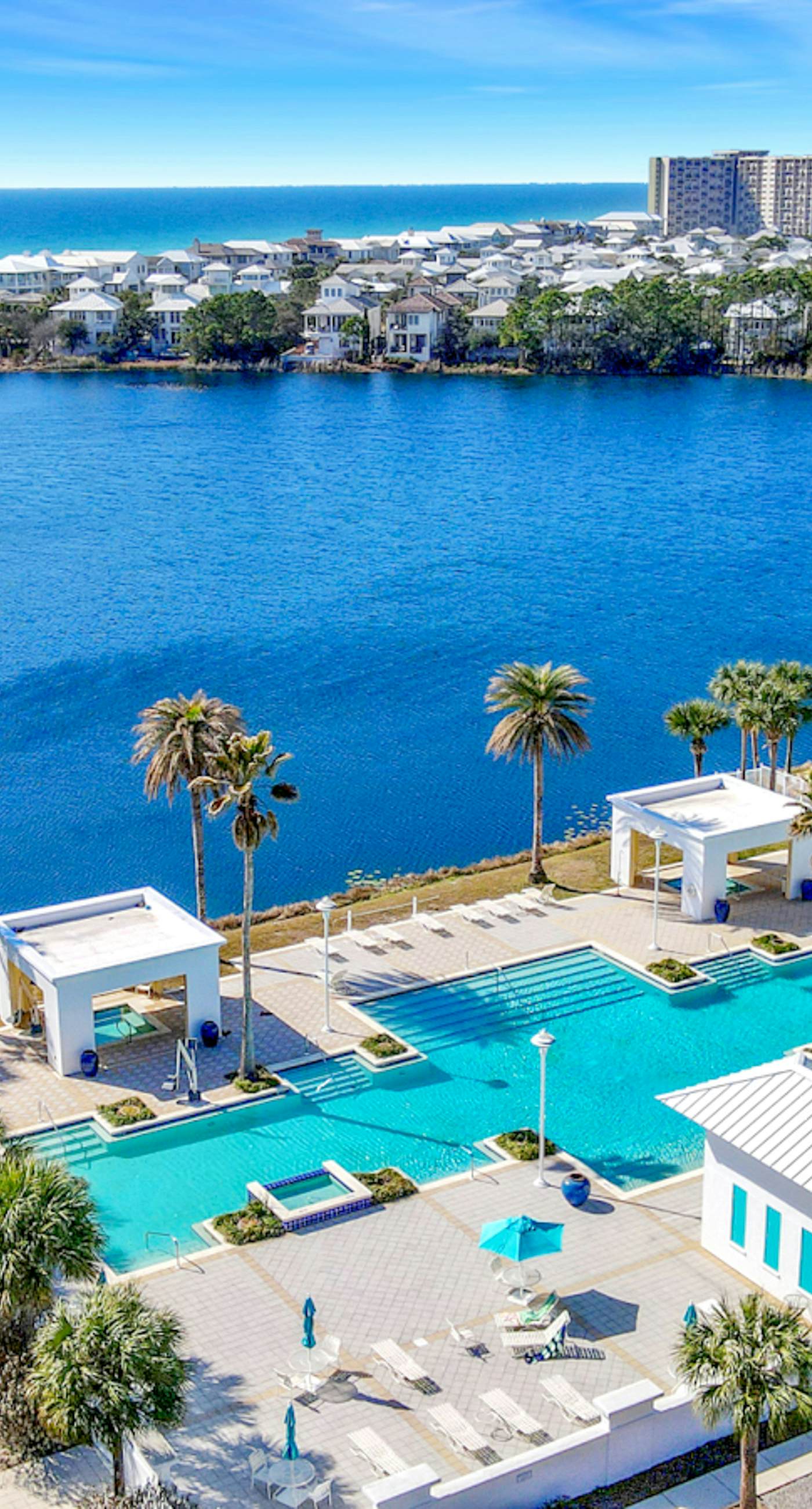 Stunning lake-view condo with private balcony, pools, hot tub, & private beach