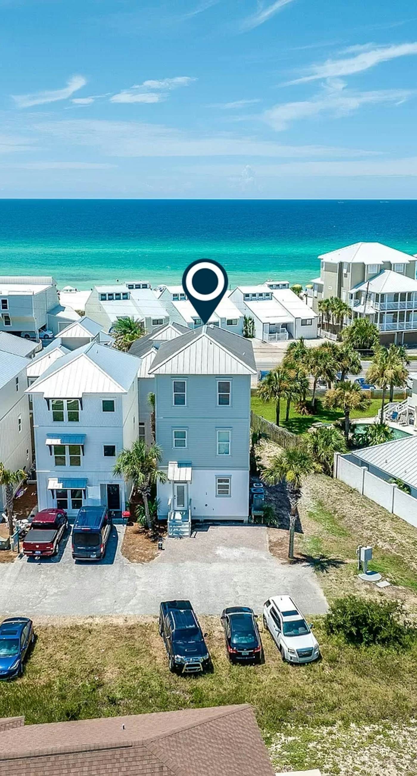 3-story home near the beach with balconies, water views, washer/dryer, & AC