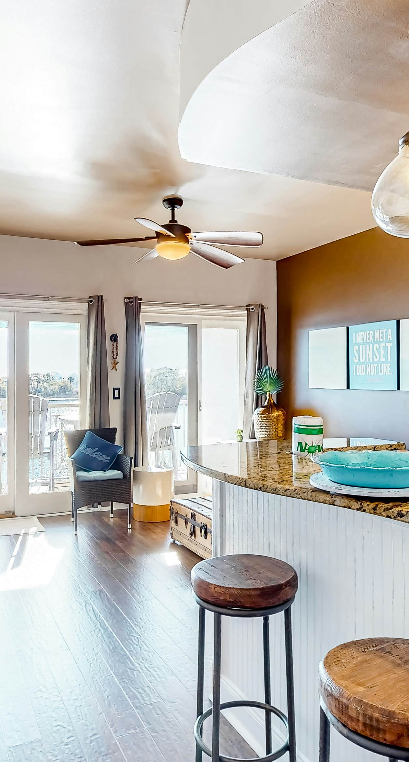 Water-view condo with on-site pool, hot tub, beachfront access, & sports courts