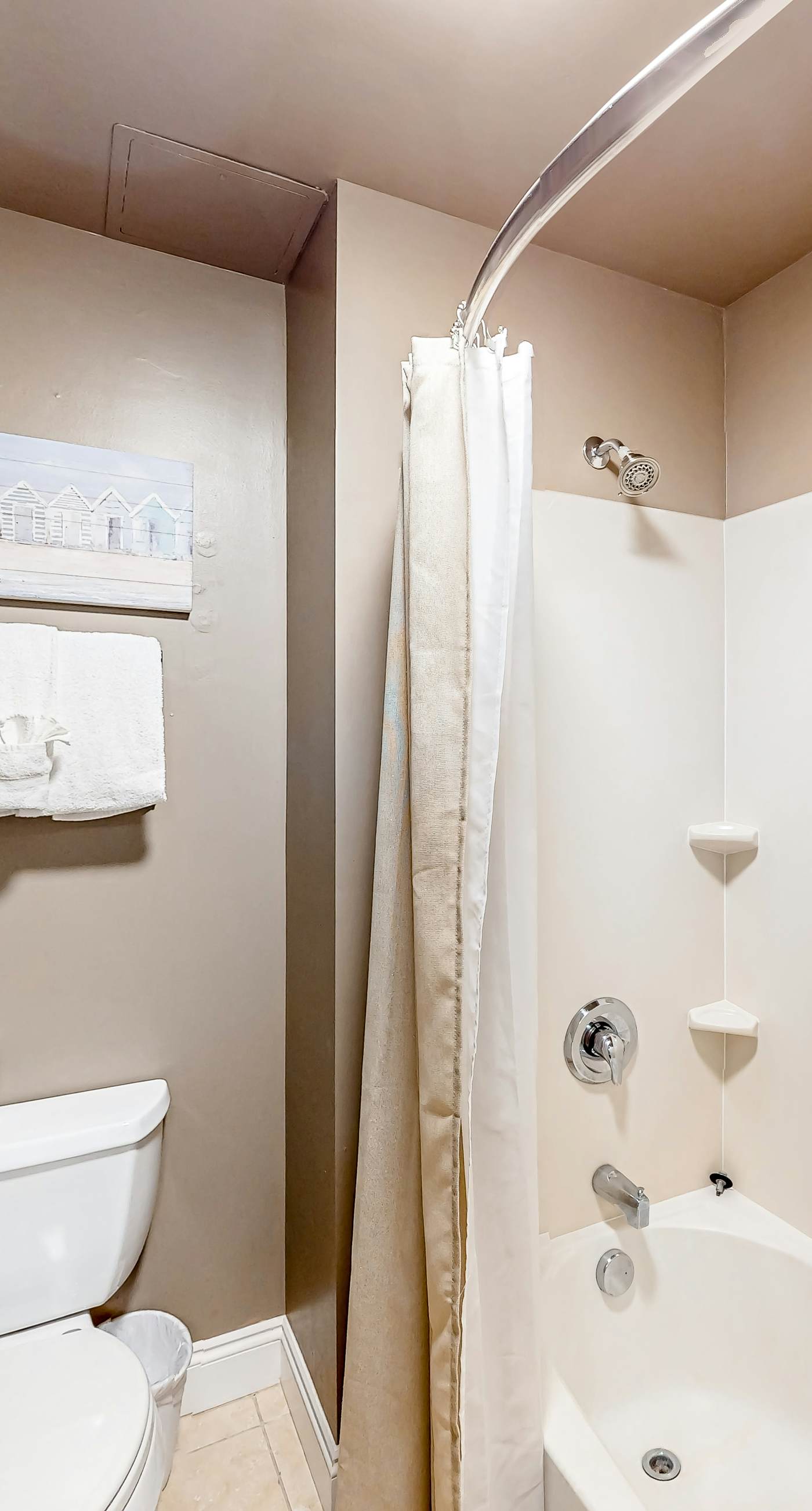 Water-view condo with on-site pool, hot tub, beachfront access, & sports courts