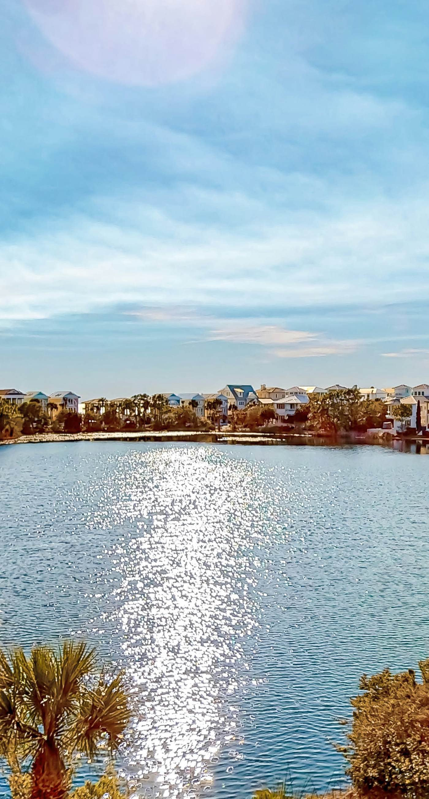 Water-view condo with on-site pool, hot tub, beachfront access, & sports courts