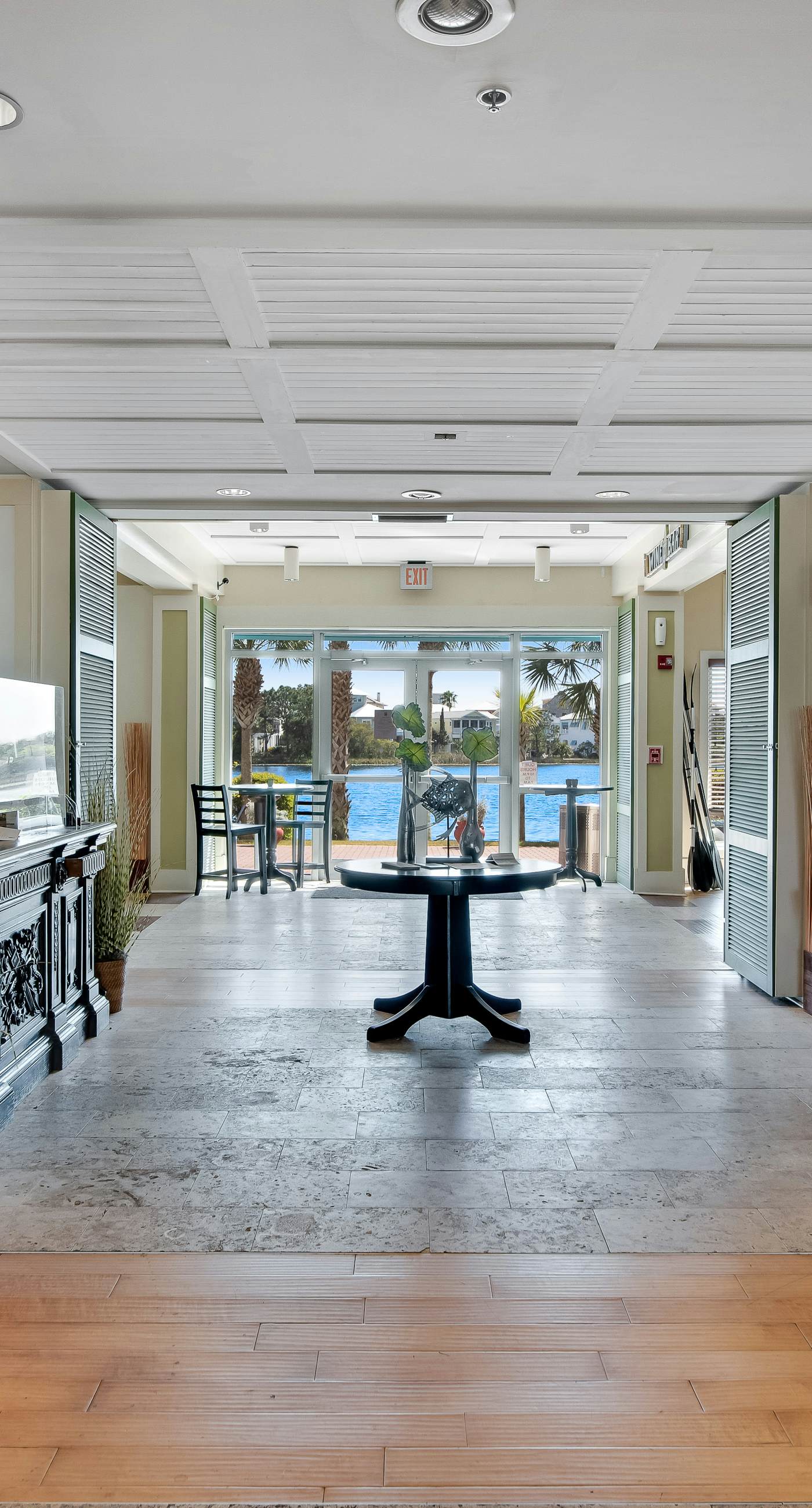 Water-view condo with on-site pool, hot tub, beachfront access, & sports courts