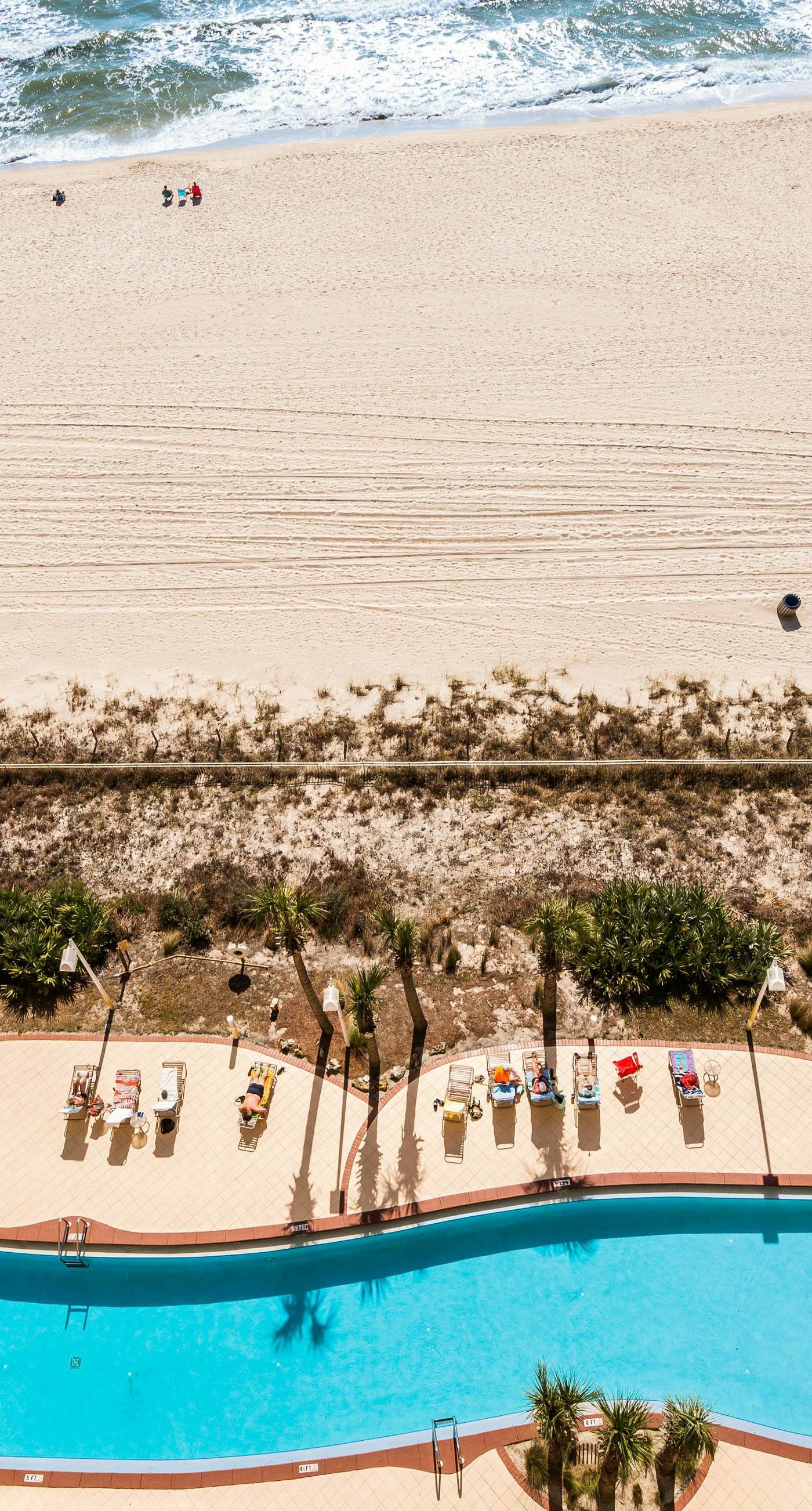 High-rise condo with pool & ocean views - walk to the beach