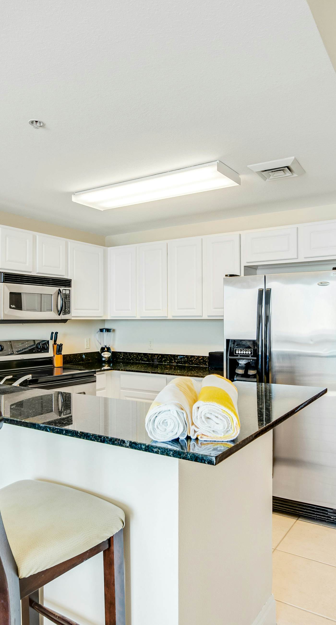 High-rise condo with pool & ocean views - walk to the beach