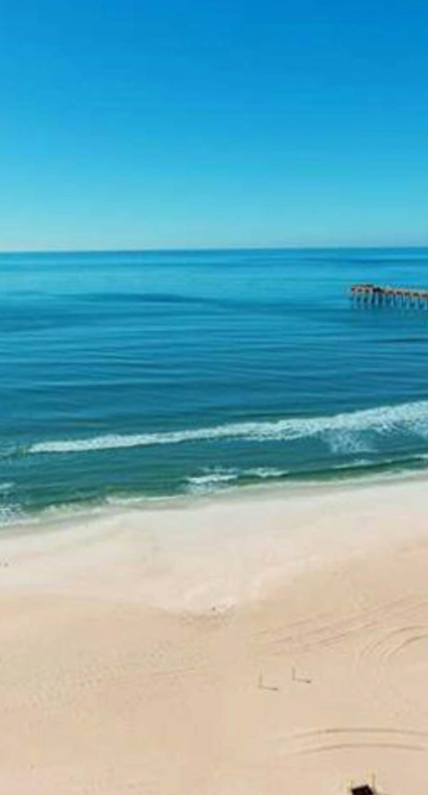 High-rise condo with pool & ocean views - walk to the beach