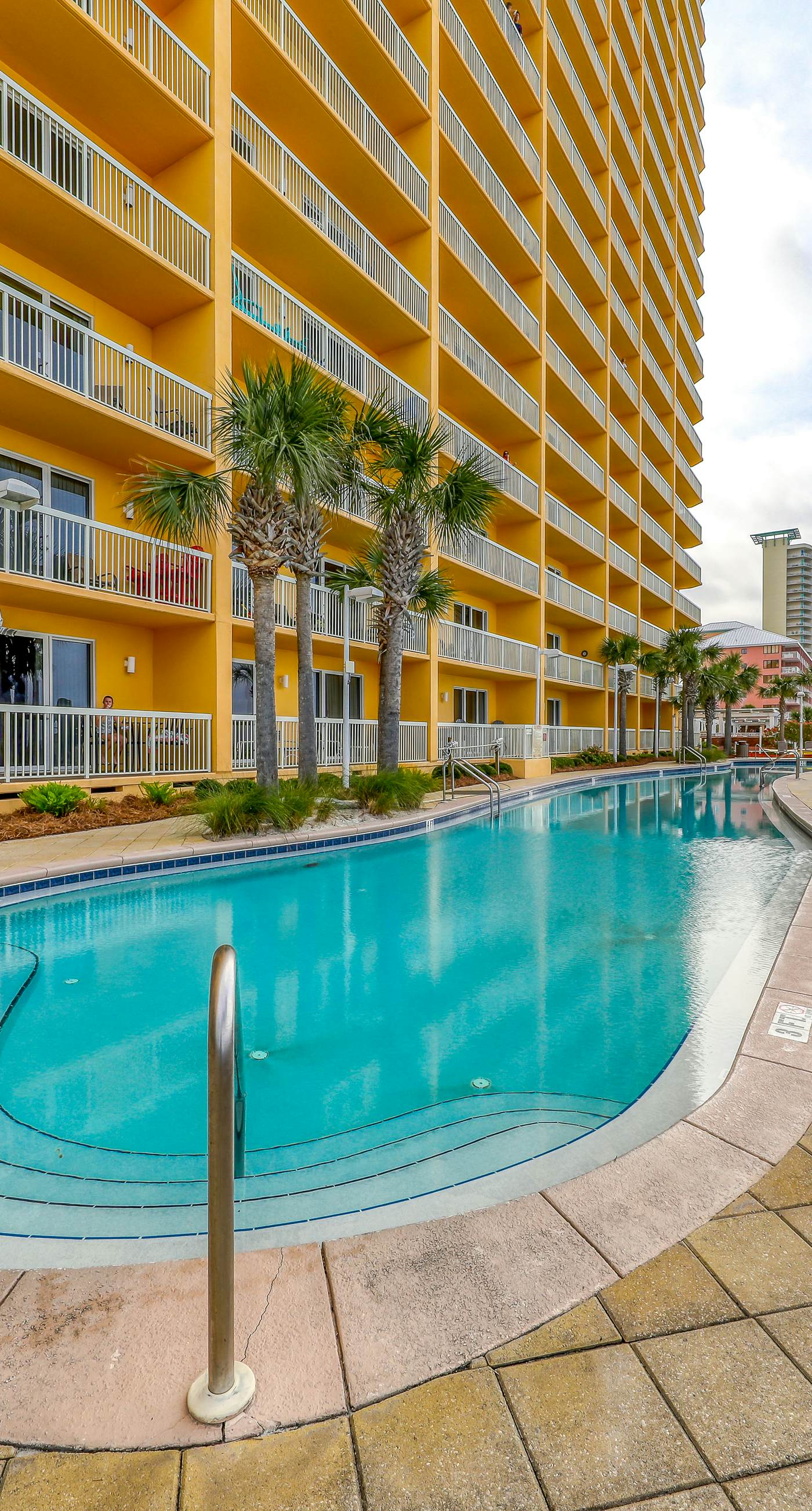 High-rise condo with pool & ocean views - walk to the beach