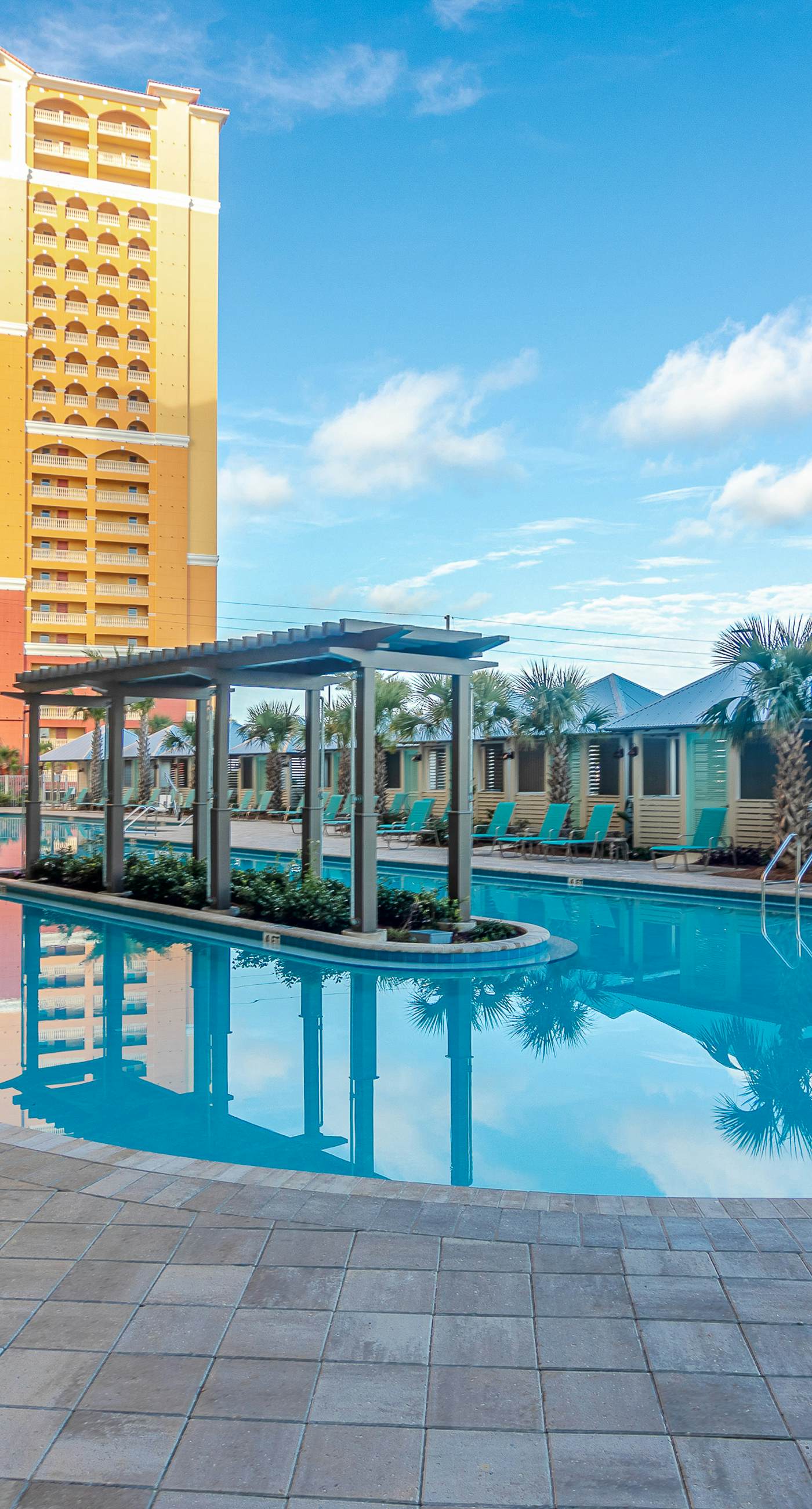 Ocean-view 10th-floor condo with balcony, heated outdoor pool, hot tub, gym, W&D