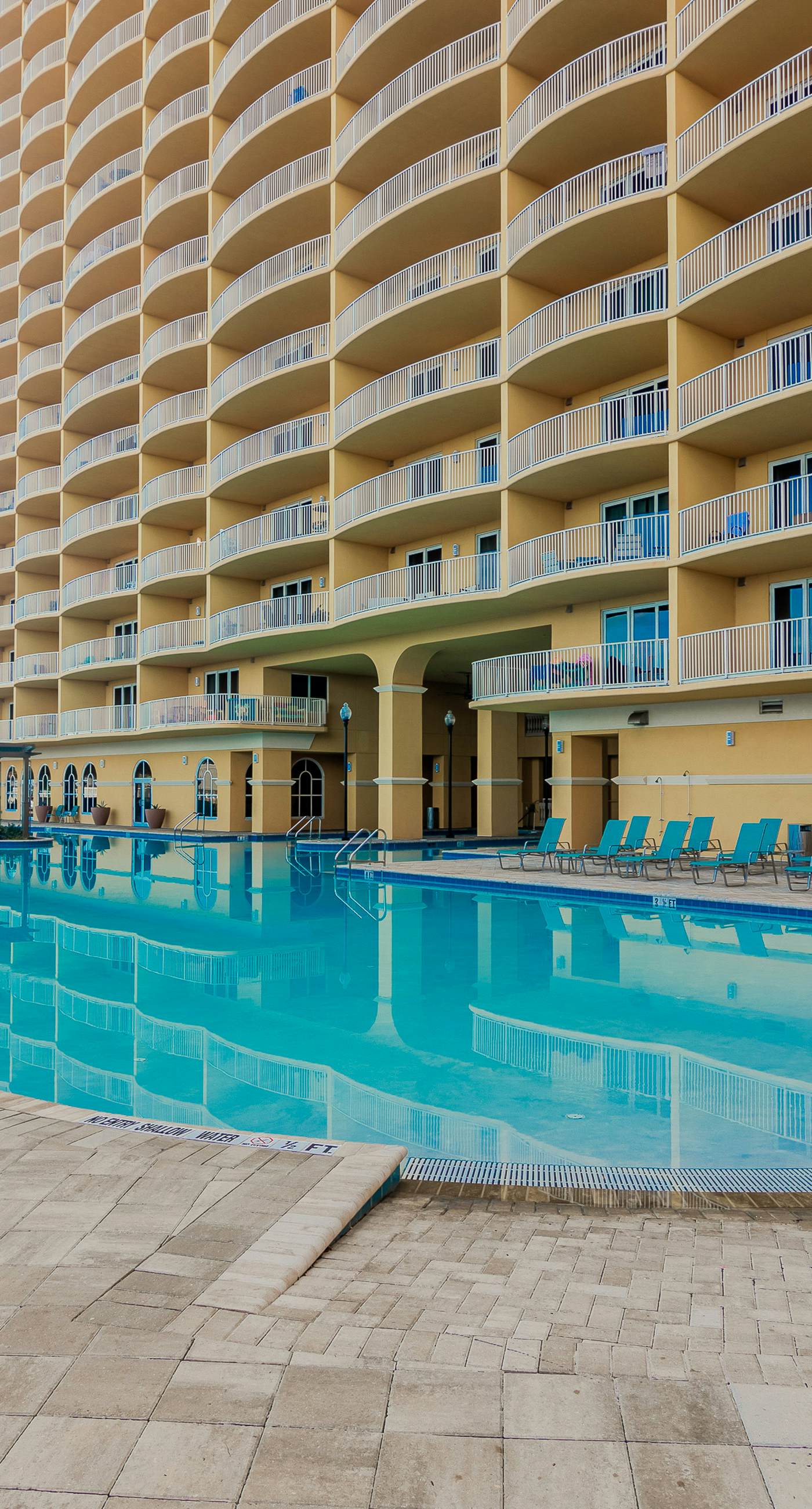 Ocean-view 10th-floor condo with balcony, heated outdoor pool, hot tub, gym, W&D