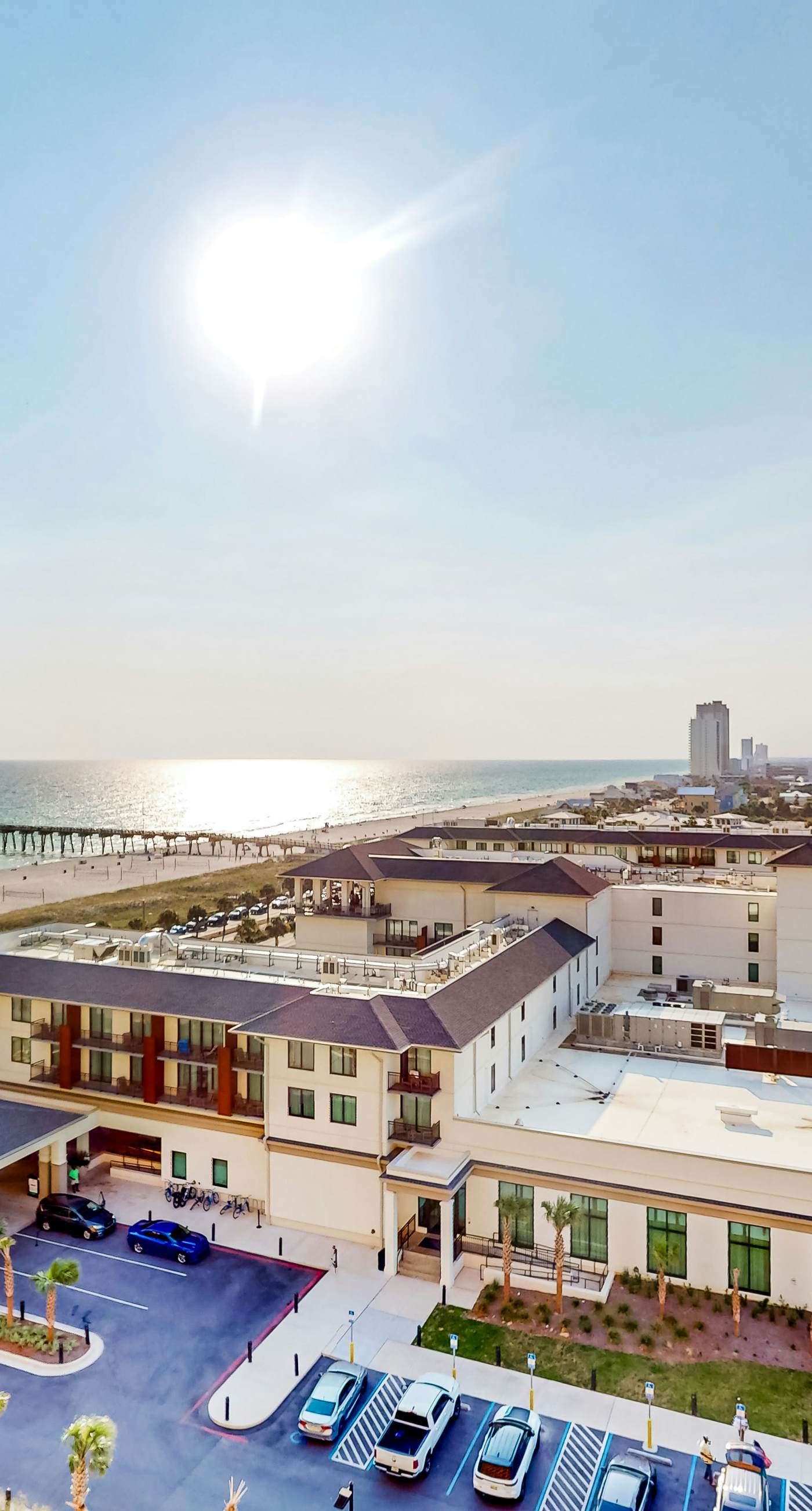 Ocean-view 10th-floor condo with balcony, heated outdoor pool, hot tub, gym, W&D