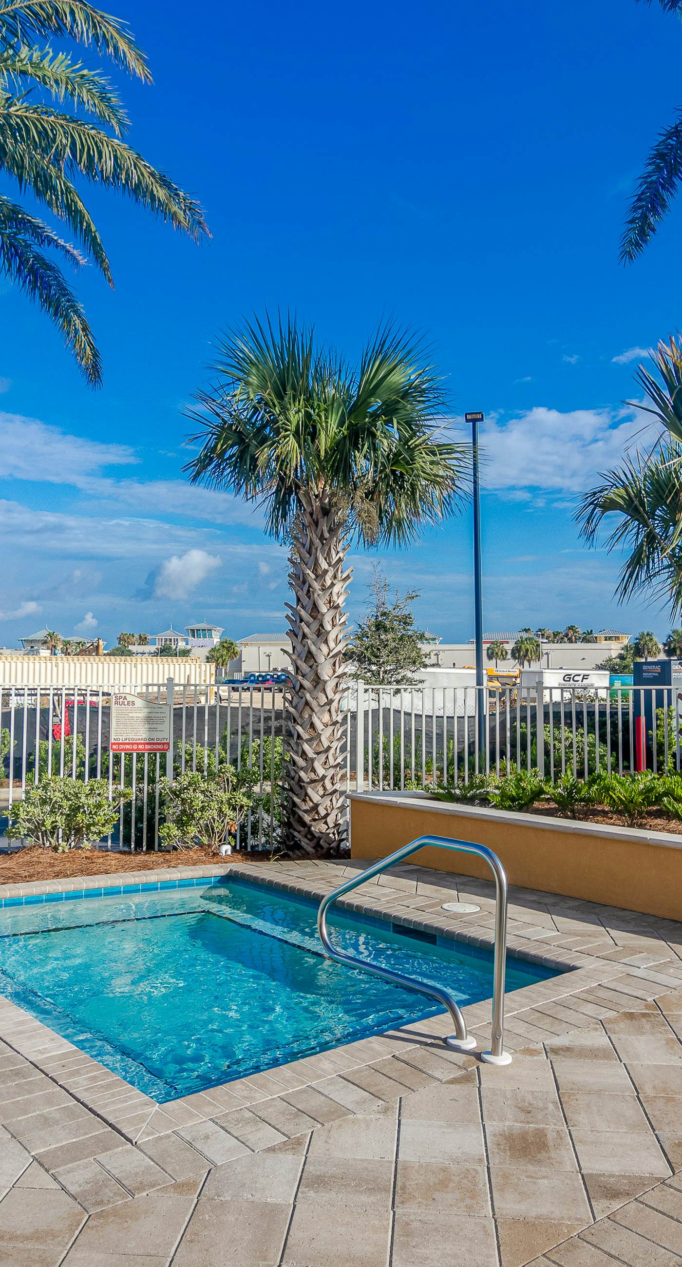 Ocean-view 10th-floor condo with balcony, heated outdoor pool, hot tub, gym, W&D