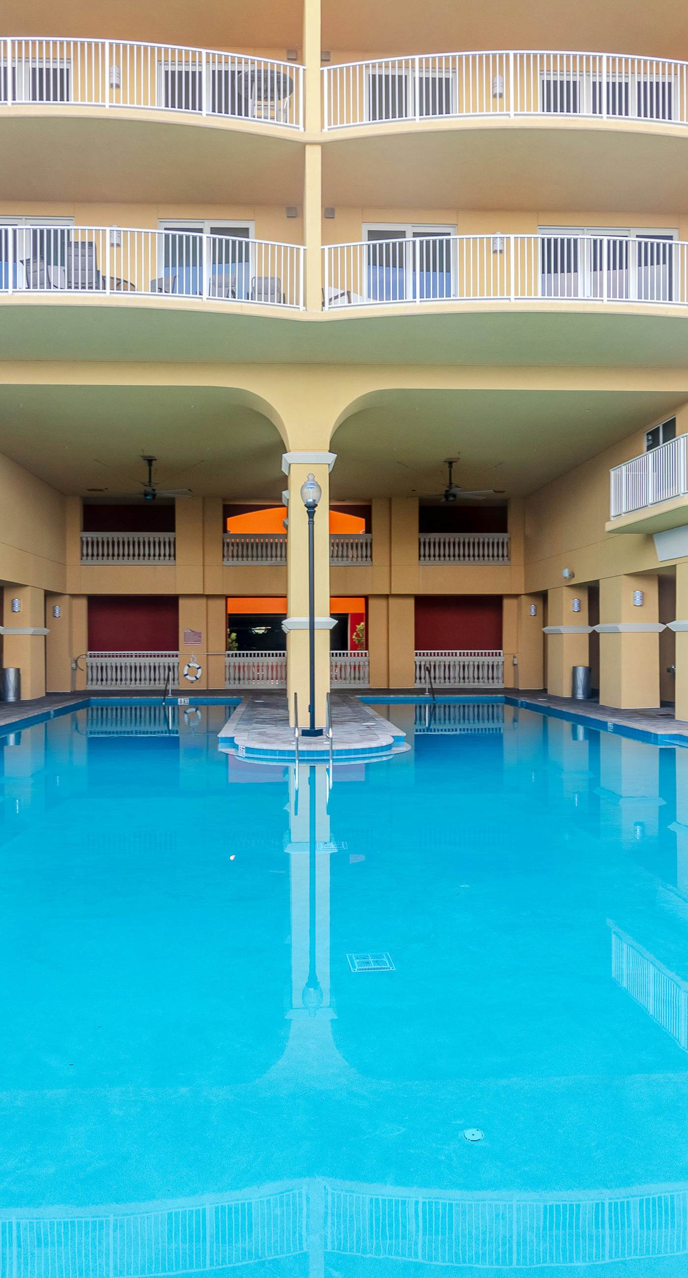 Ocean-view 10th-floor condo with balcony, heated outdoor pool, hot tub, gym, W&D