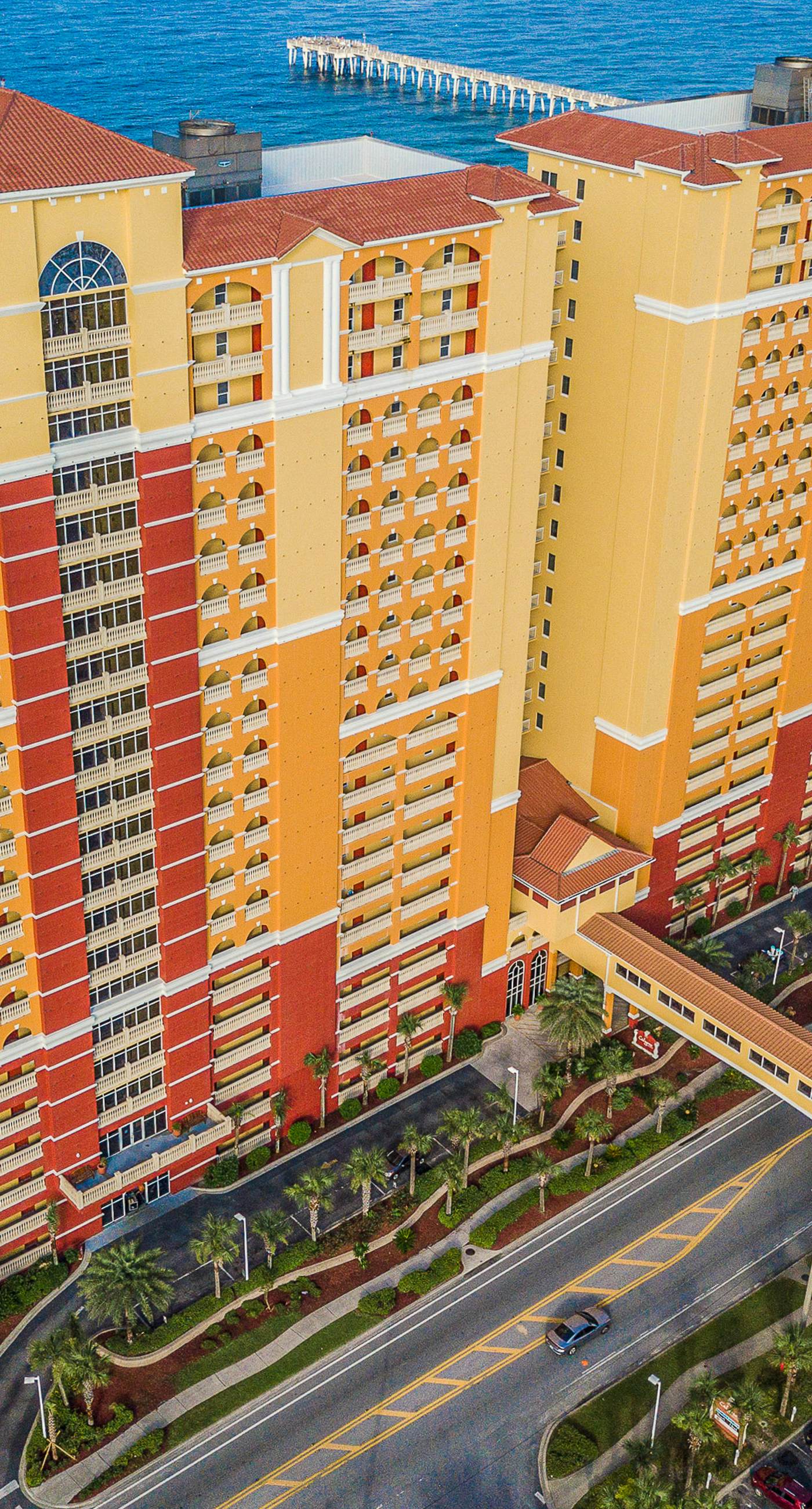 Ocean-view 10th-floor condo with balcony, heated outdoor pool, hot tub, gym, W&D