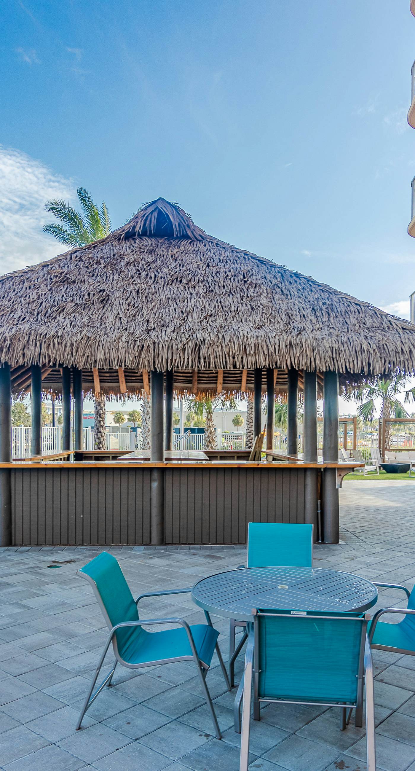 Ocean-view 10th-floor condo with balcony, heated outdoor pool, hot tub, gym, W&D