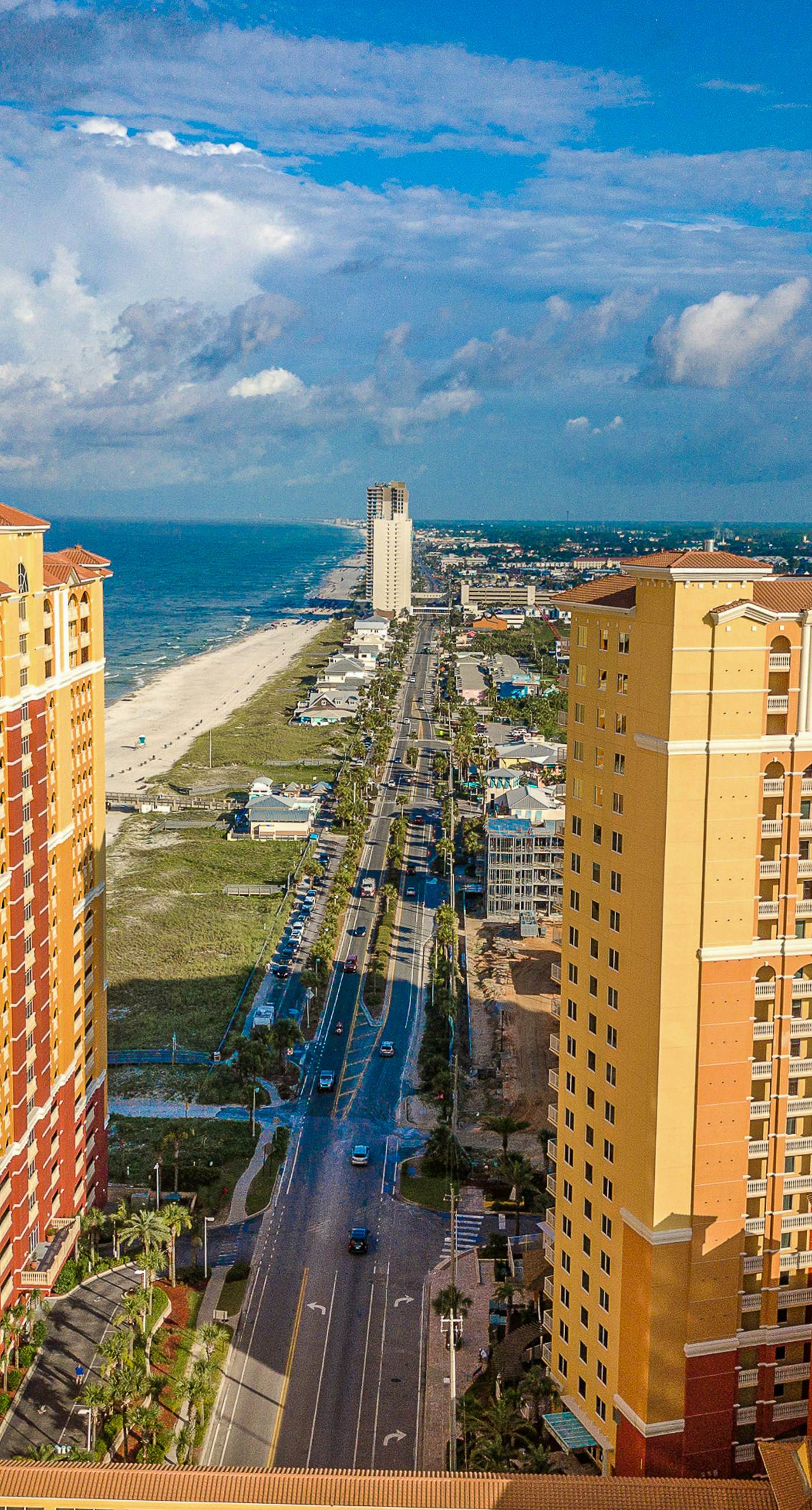 Ocean-view 10th-floor condo with balcony, heated outdoor pool, hot tub, gym, W&D