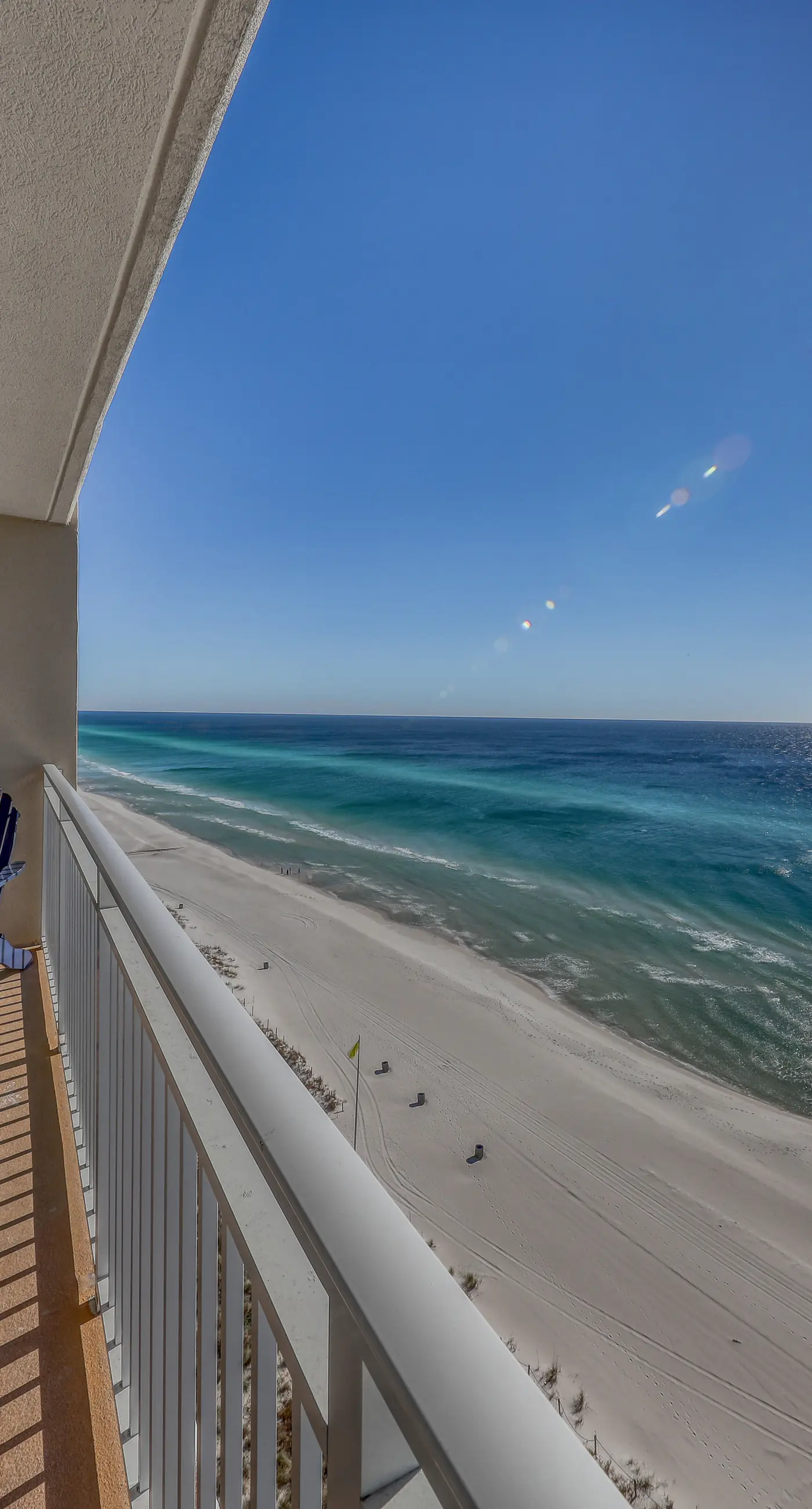 Light-filled beachfront condo with shared pool, hot tub & beach access
