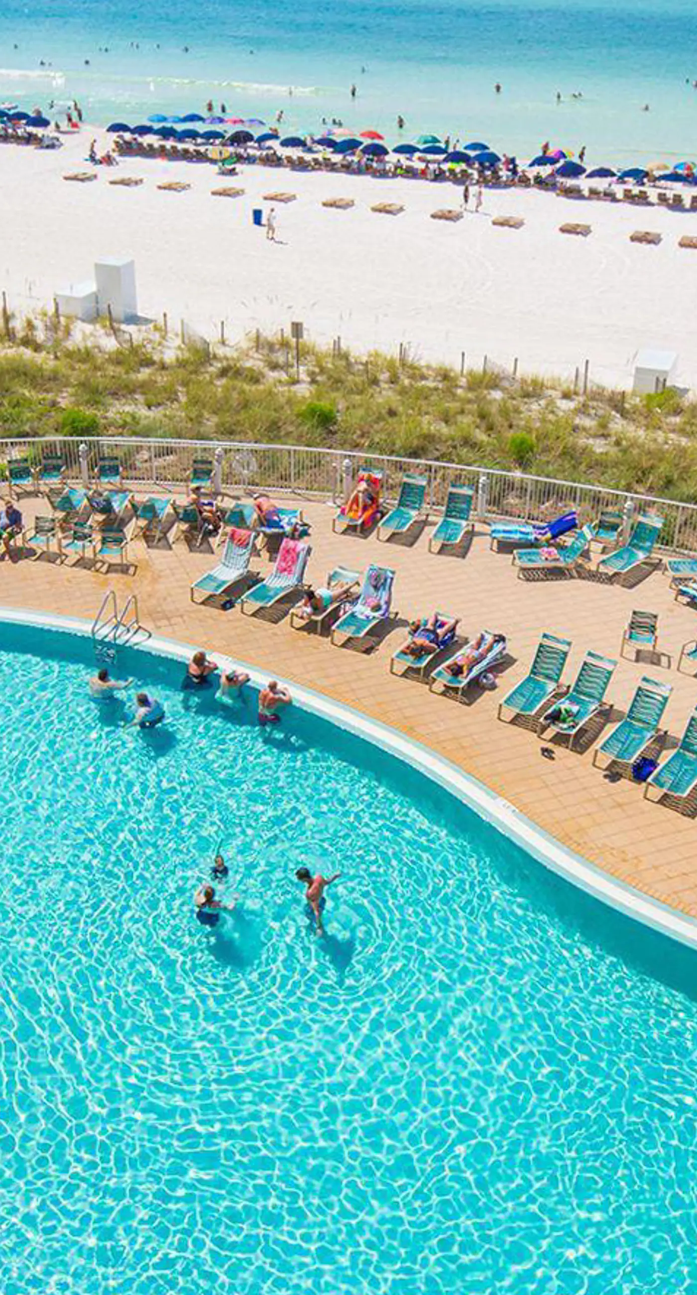 Light-filled beachfront condo with shared pool, hot tub & beach access