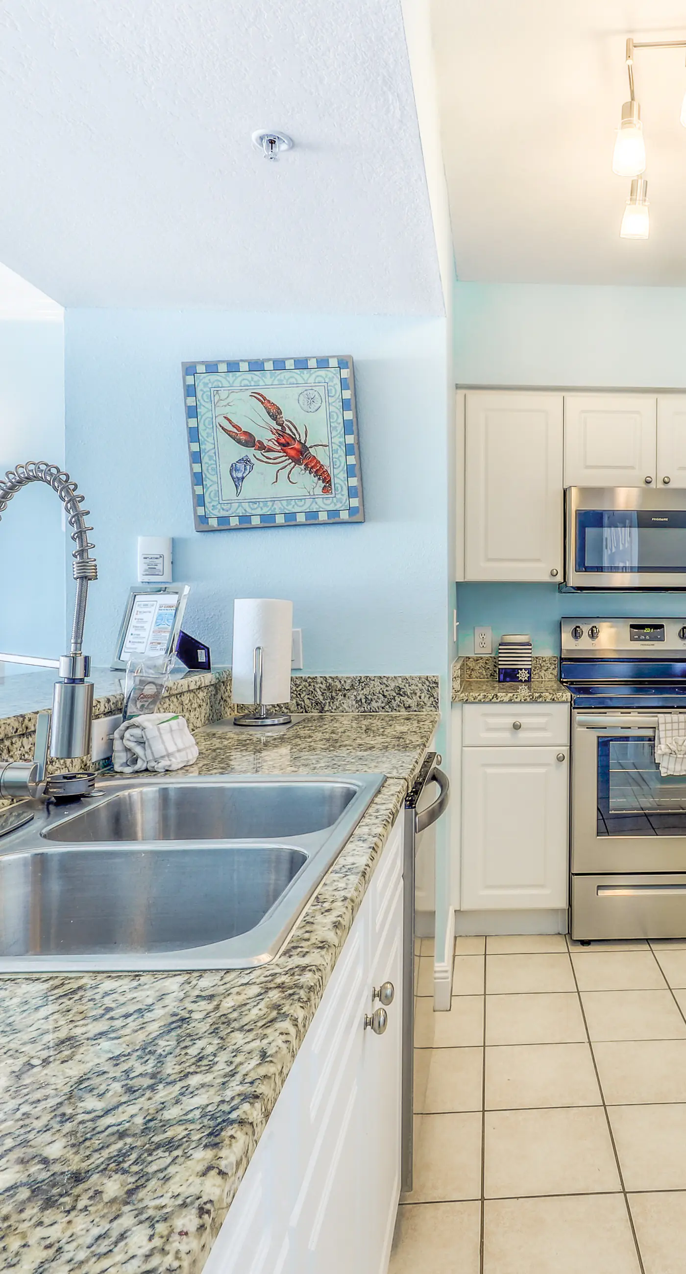 Light-filled beachfront condo with shared pool, hot tub & beach access